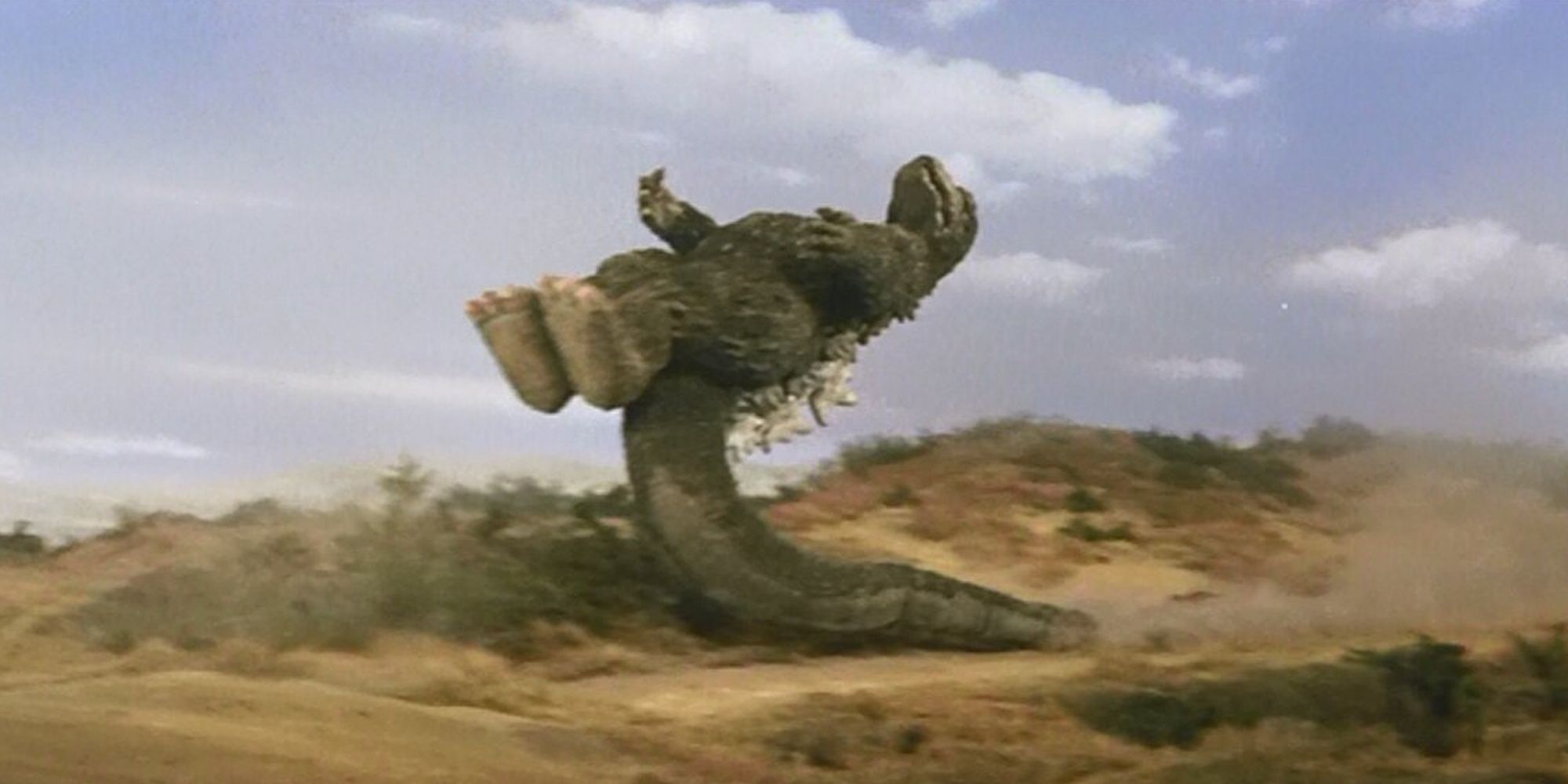 Godzilla: Godzilla Sliding On His Tail