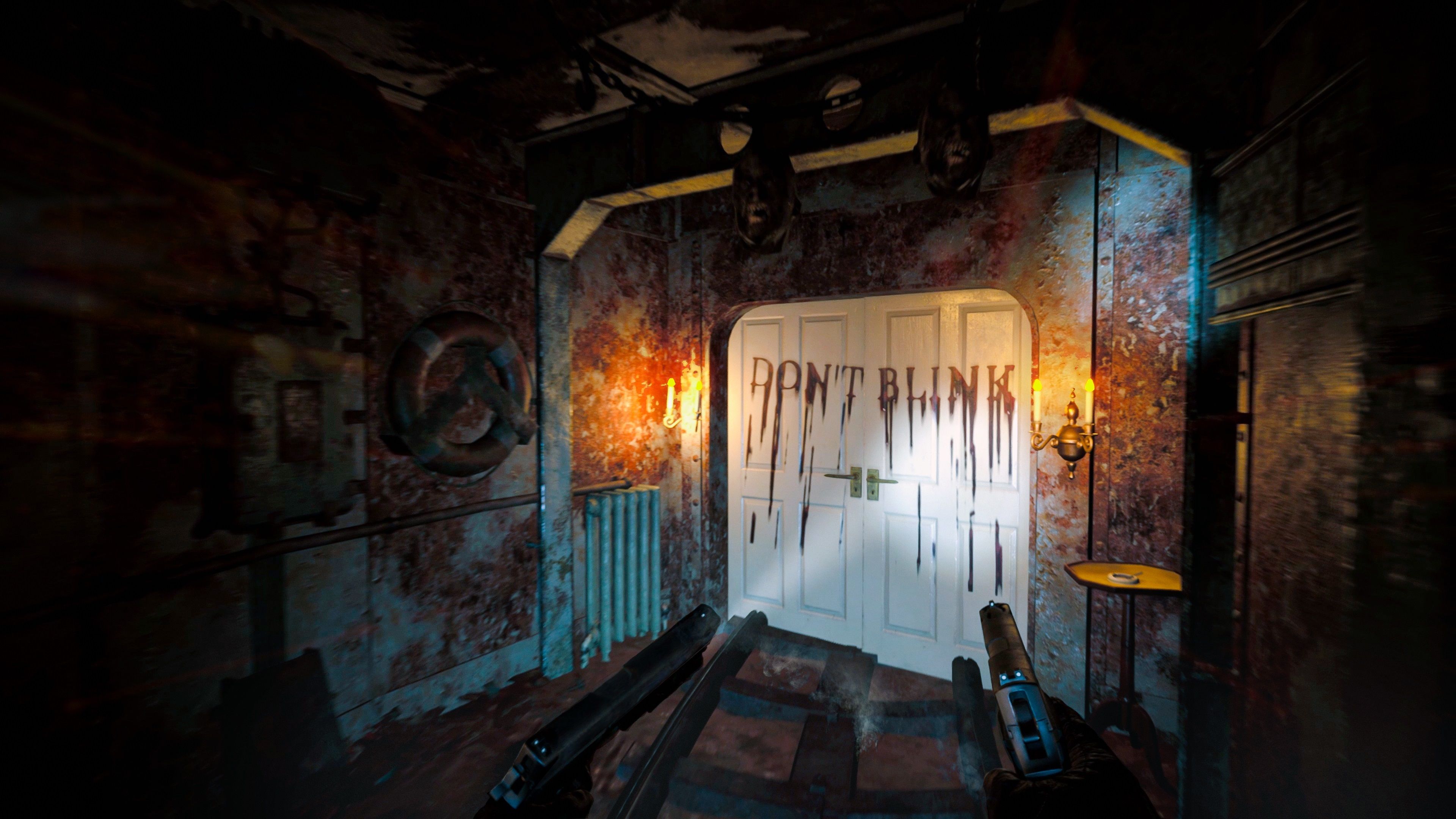 The Dark Pictures Switchback VR a door that has 'don't blink' scrawled across it in blood