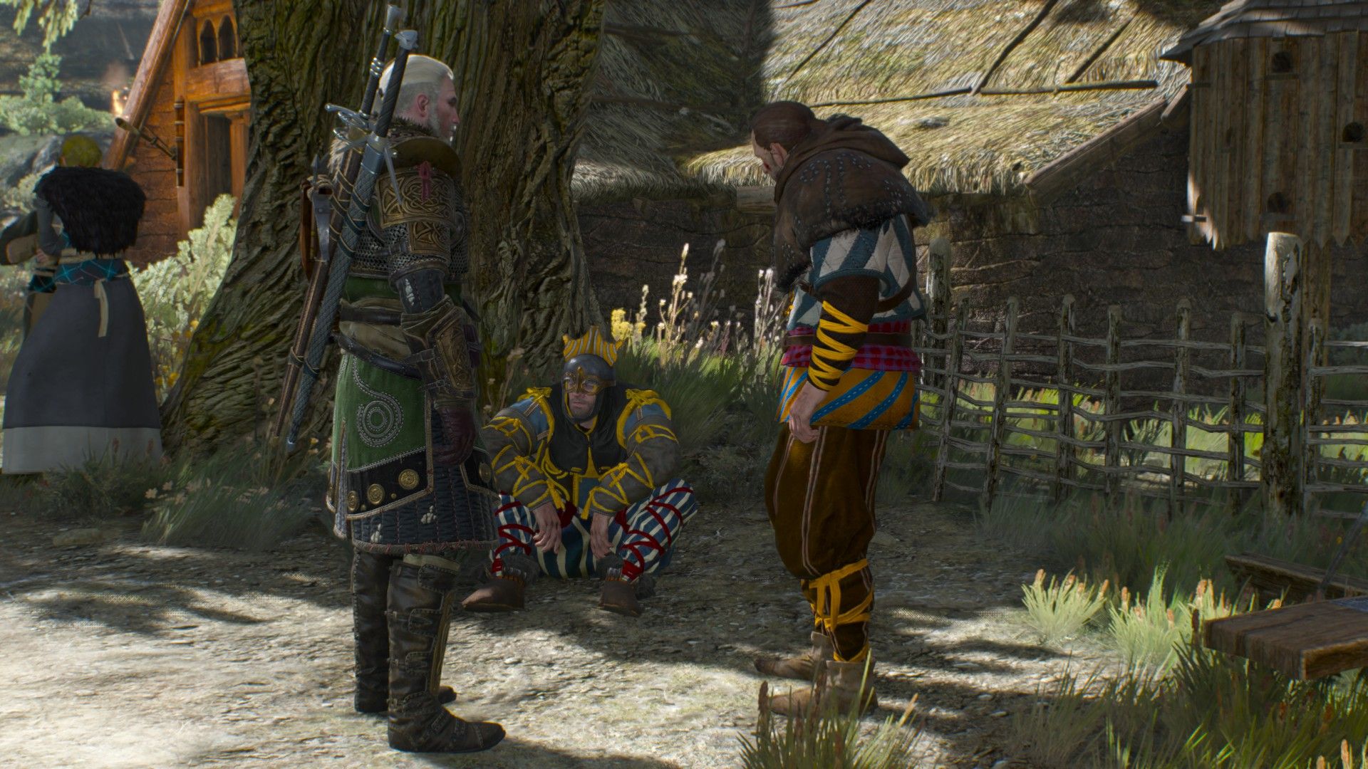 Geralt, wearing Skellige armor, talks to a pair of battered and bloodstained survivors of a monster attack at their village.