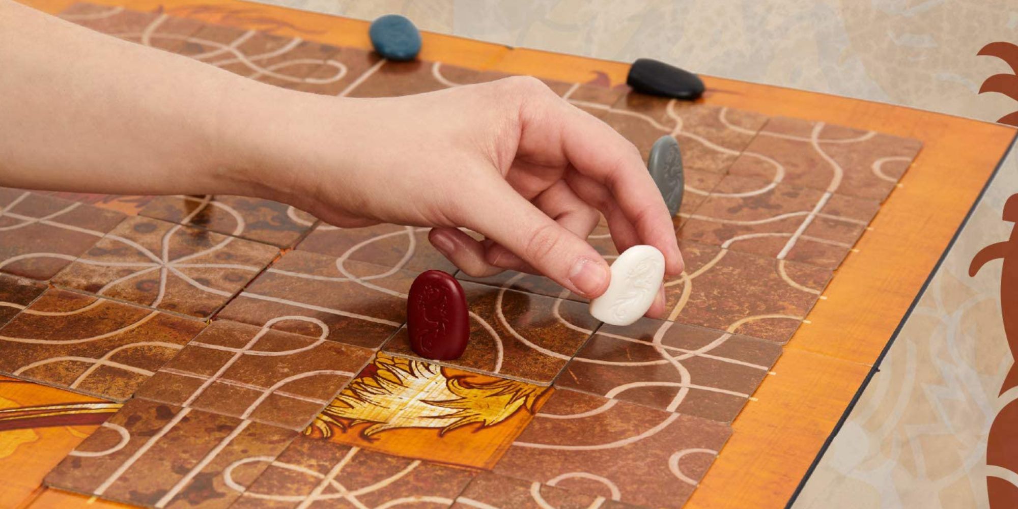 Tsuro board and counters being played