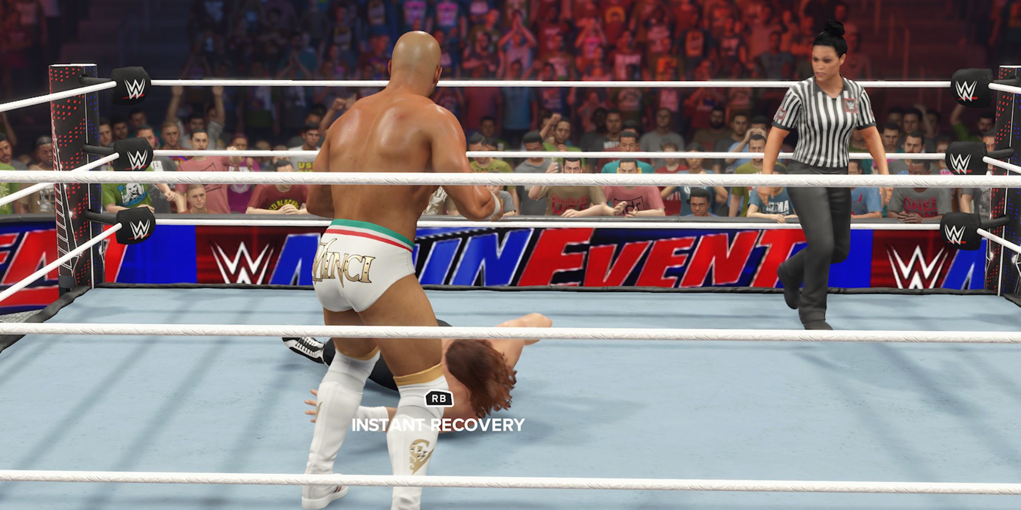 WWE 2K23 Screenshot Of Giovanni Vinci Standing Over Sami Zayn