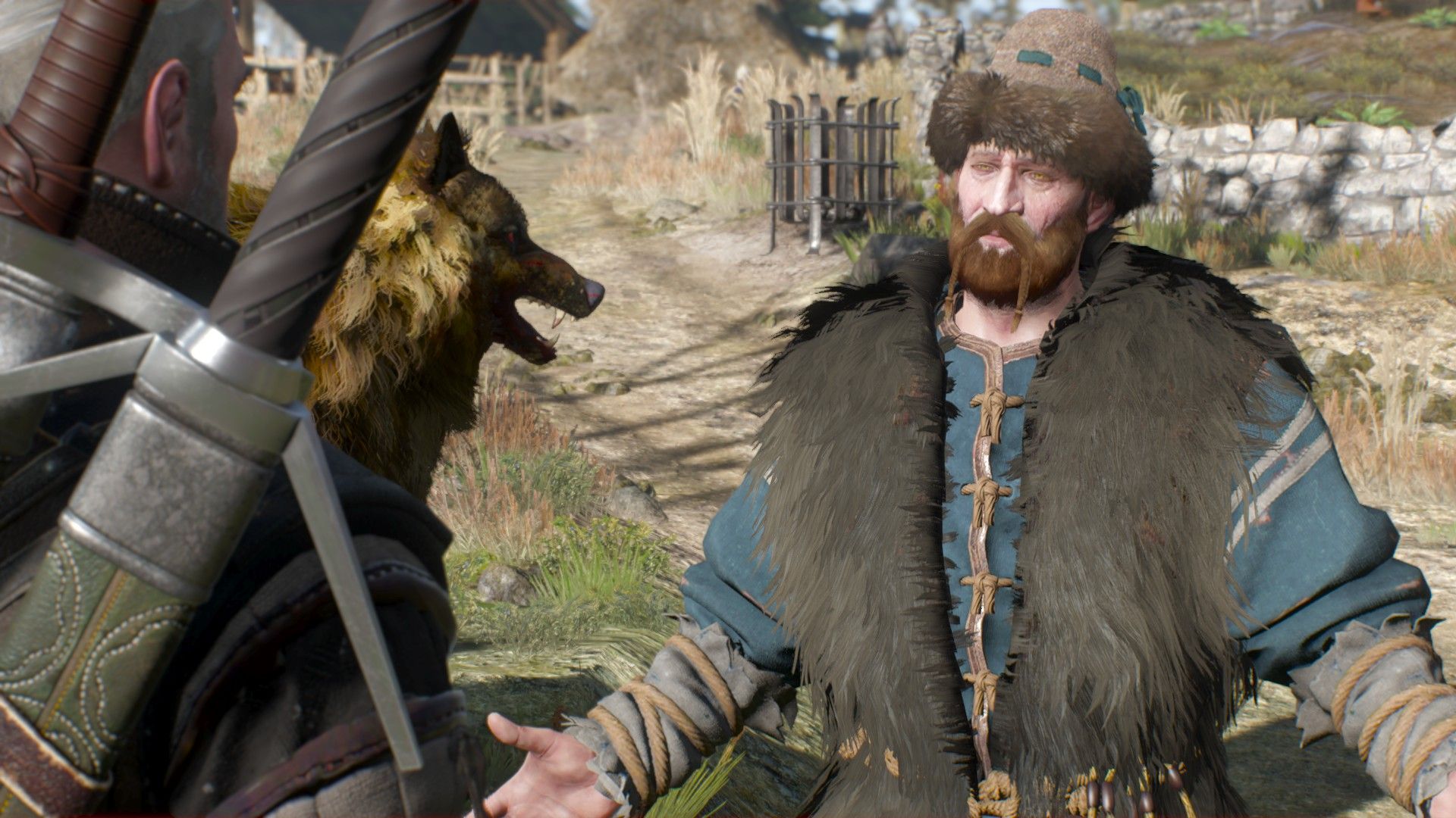 A fur-clad Skelliger spreads his arms and talks to Geralt in the village.