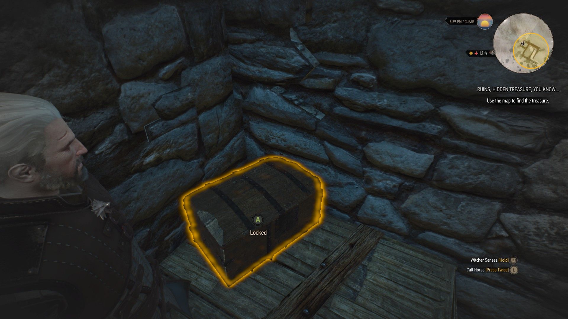 A screenshot of Geralt standing over a treasure chest in a tower in Dorve.