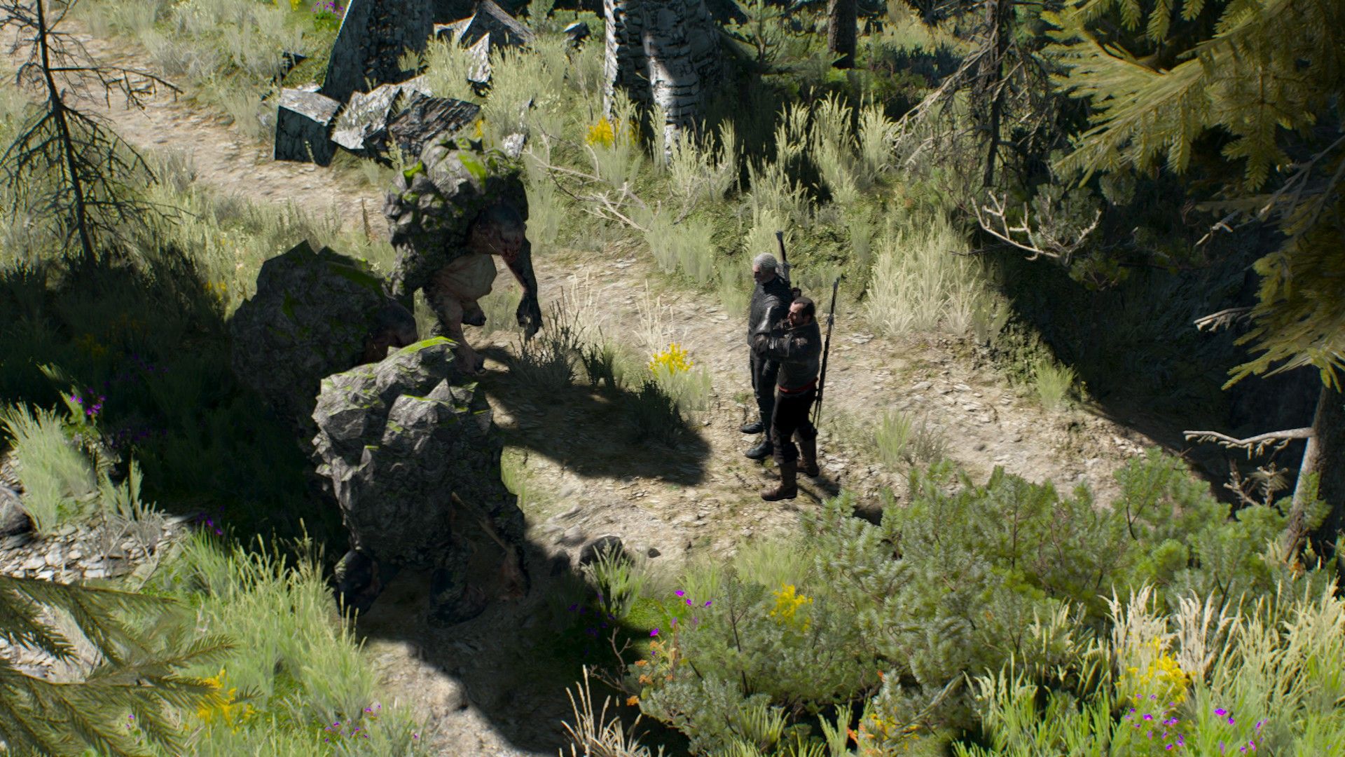 A trio of trolls slowly approach Geralt and another witcher in a grassy field atop a mountain during the day.