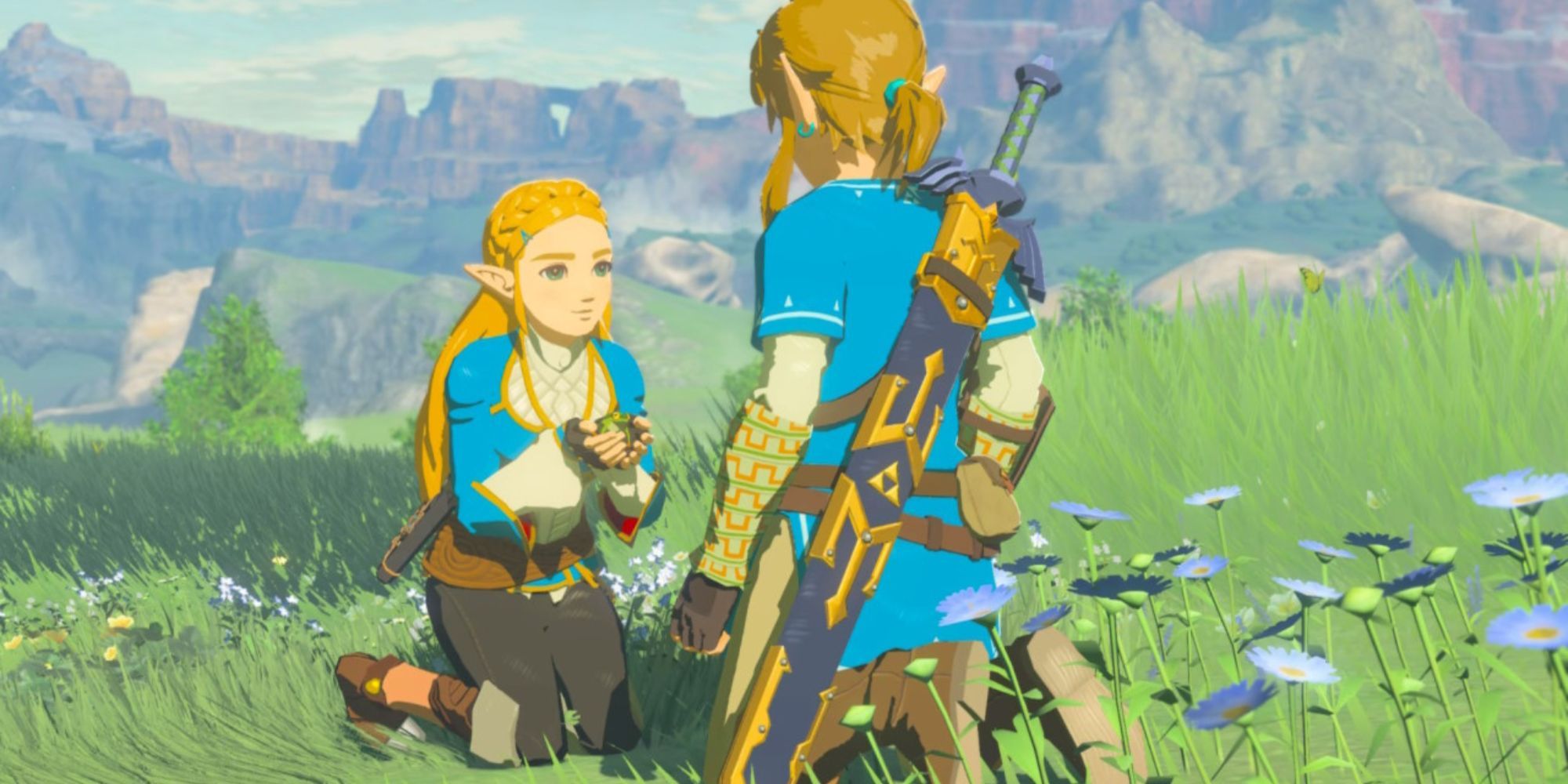 Zelda holds a frog in her hands while kneeling in the grass with Link