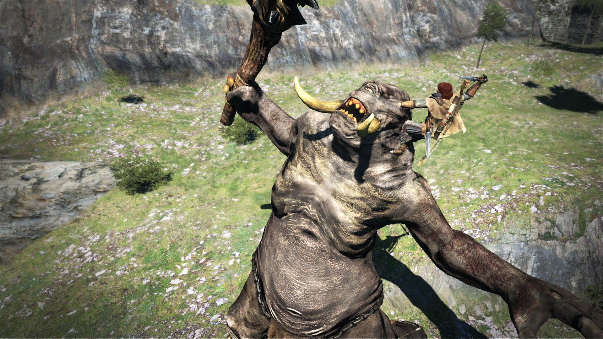 A character climbingup to a Cyclops in a open field, ready to stab the beast on its eye.