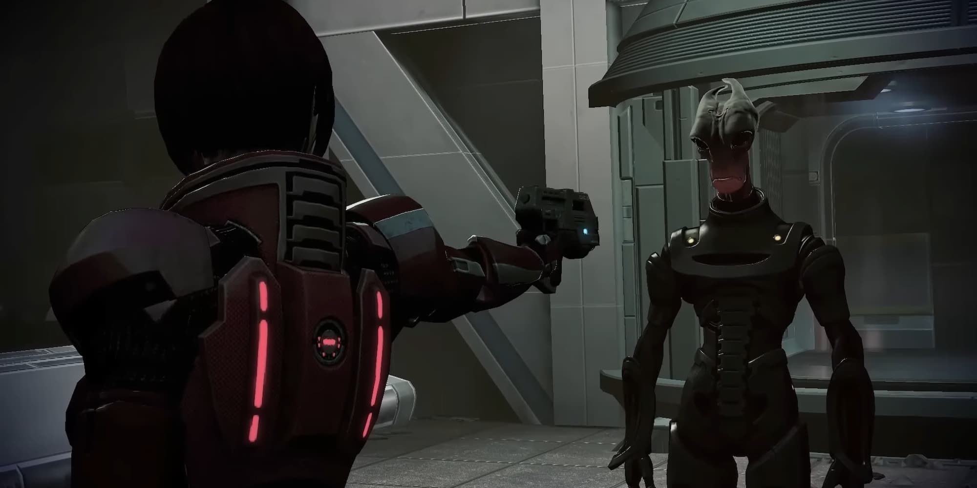 Female Commander Shepard points her gun at Mordin Solus in Mass Effect 3 to prevent the creation of the Genophage Cure.
