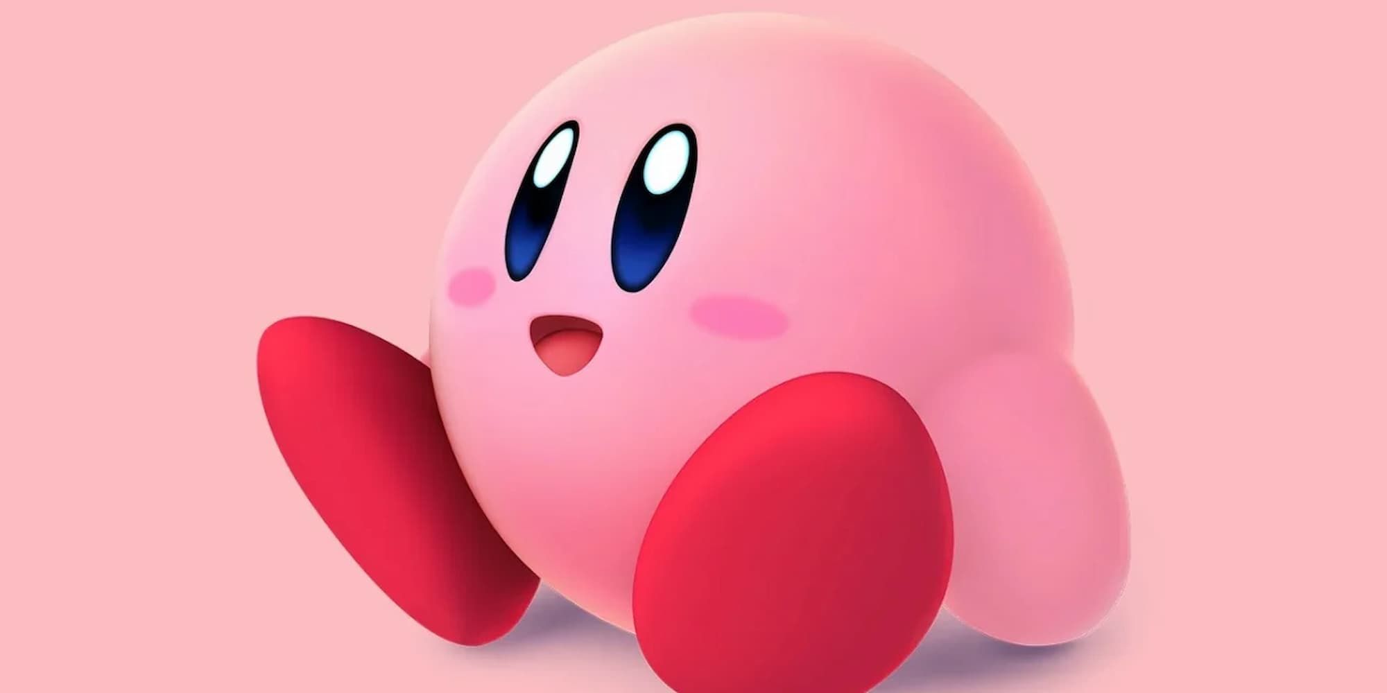 Kirby sits with wide eyes and an open-mouthed smile.