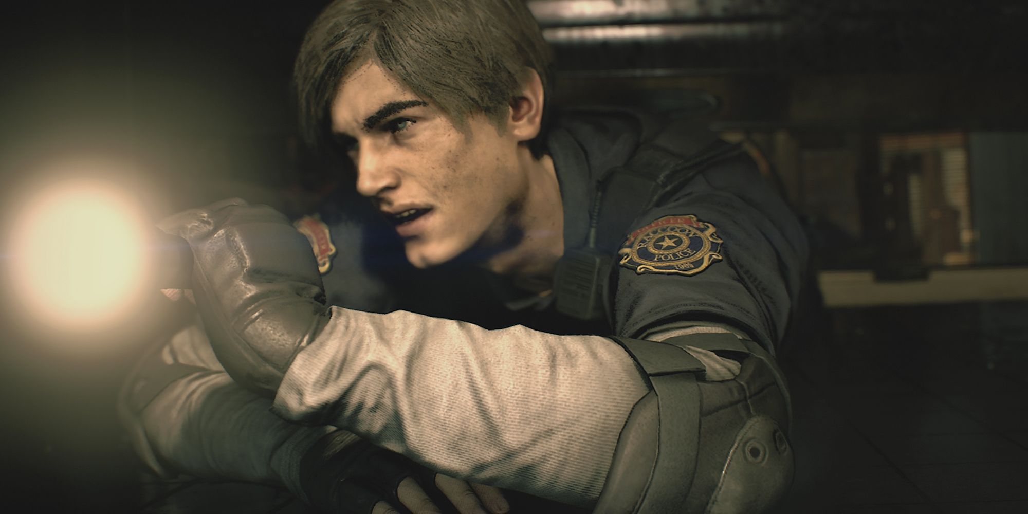 Leon Kennedy crawling with a flashlight in Resident Evil 2 Remake