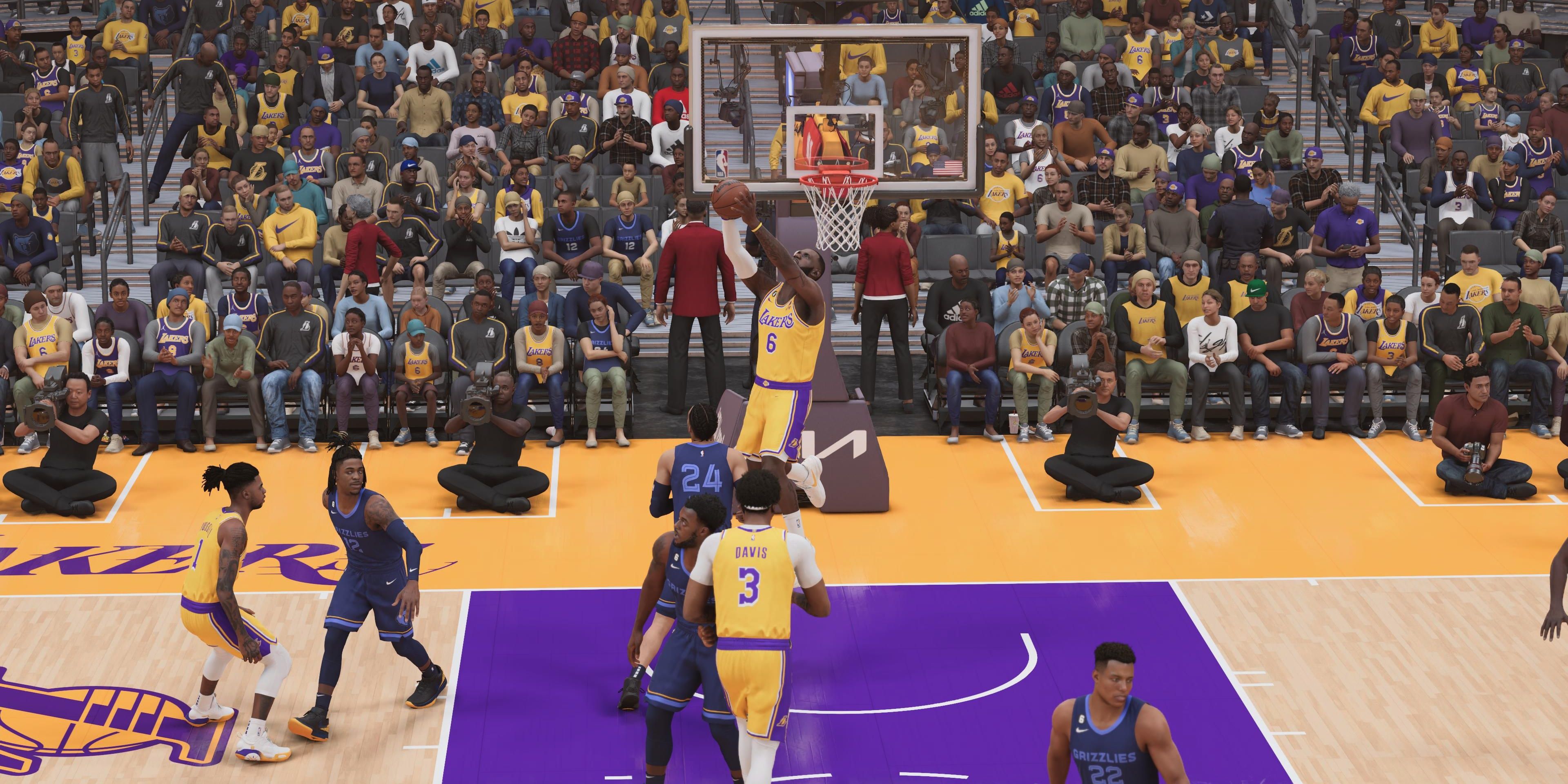 lebron james nba 2k23 dunking on ally hoop from d'angelo russell
