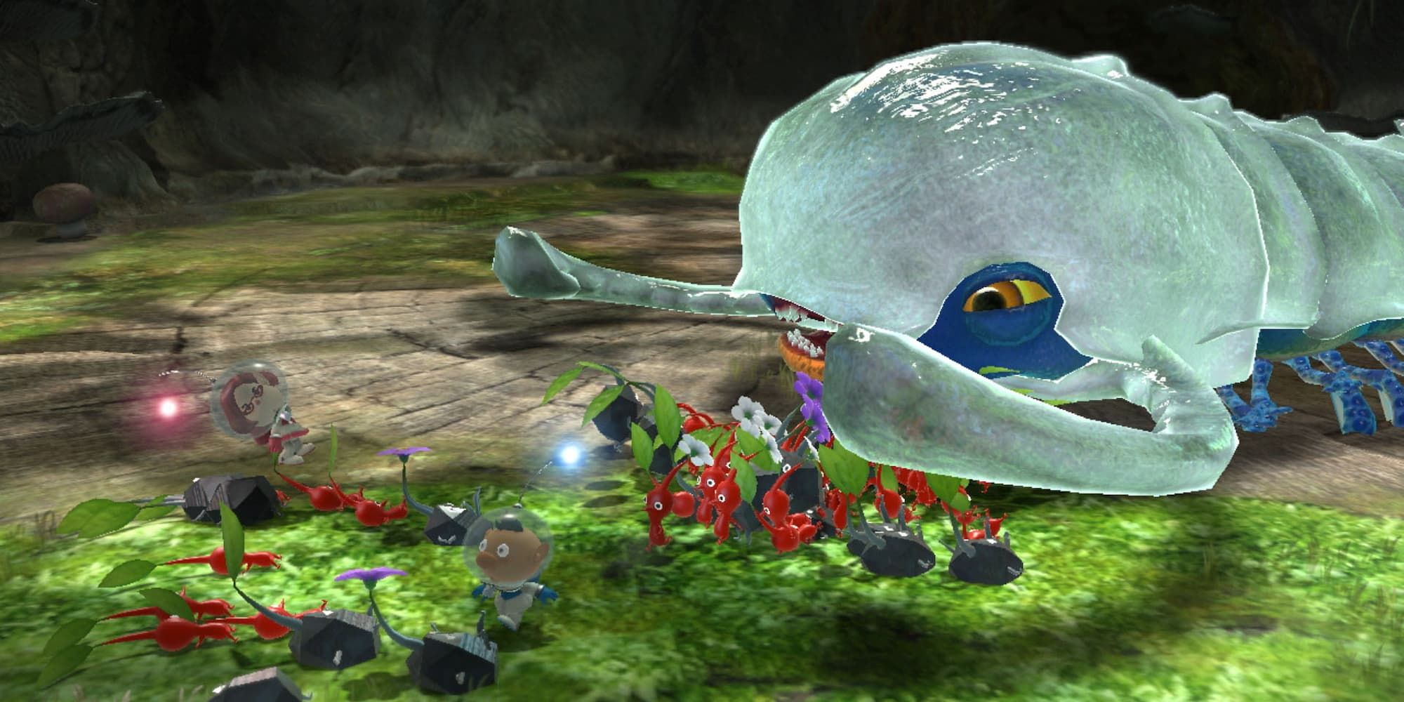 The heroes direct their Pikmin to attack a giant monster that resembles a shrimp in Pikmin 3 Deluxe.