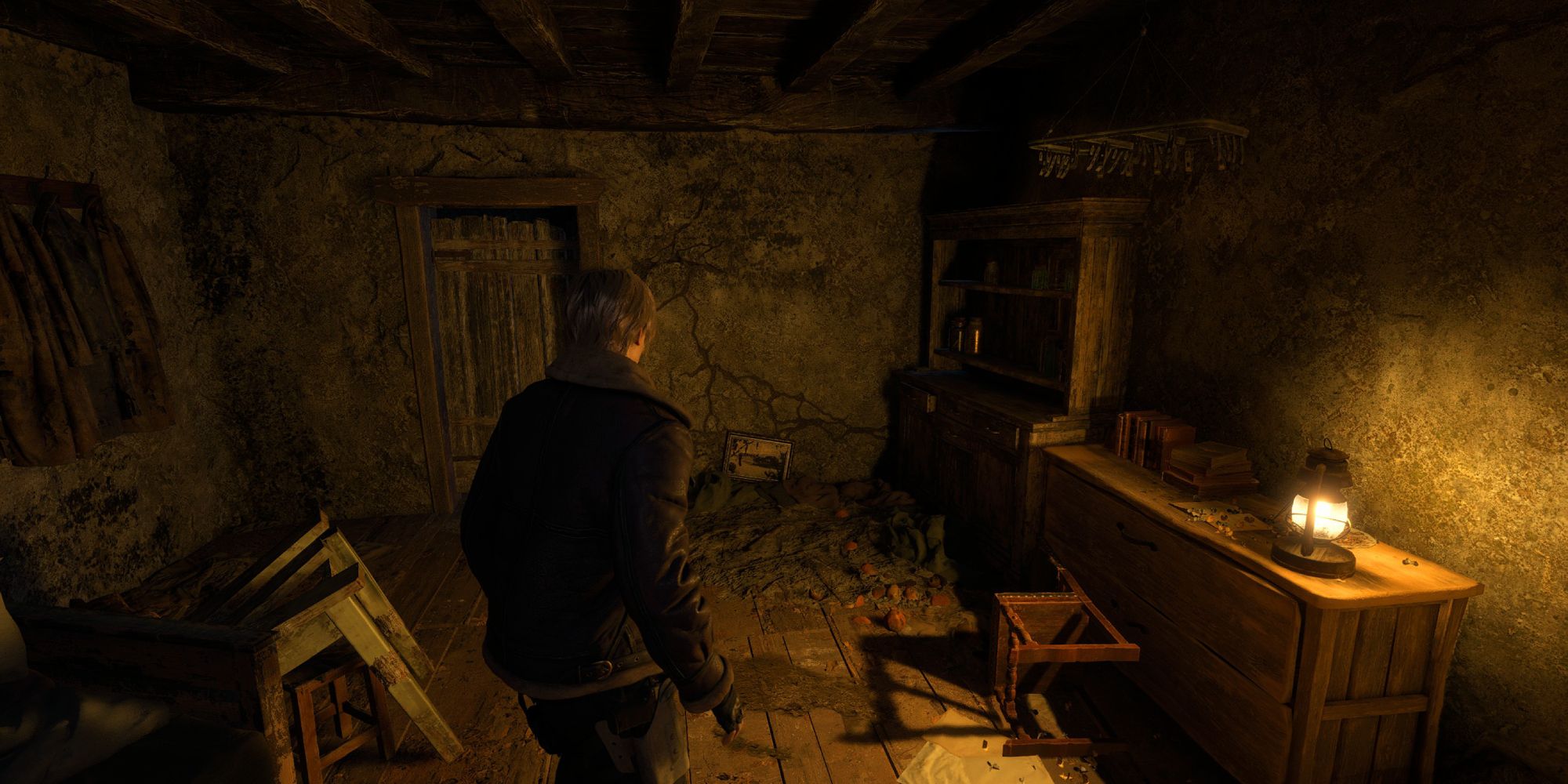 Image shows Leon standing in a room 