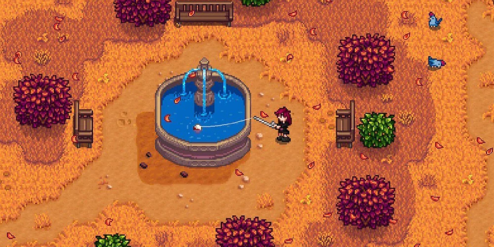 stardew valley player fishing from fountain near community center