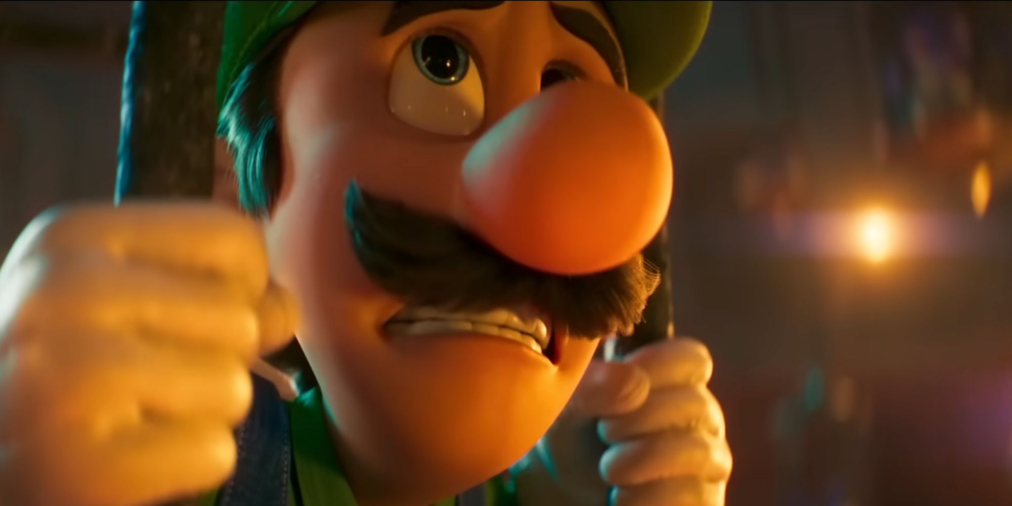 Luigi sits in a cell in a dark room in The Super Mario Bros. Movie