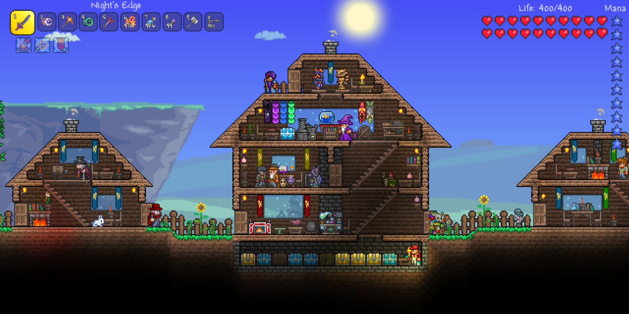 Terraria-Spieler und NPCs in drei verschiedenen Häusern