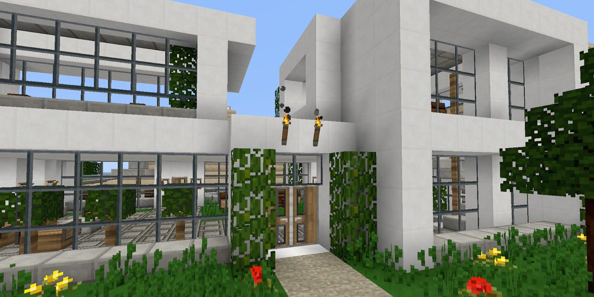 The exterior of a modern home in Minecraft designed with the Pamplemousse resource pack