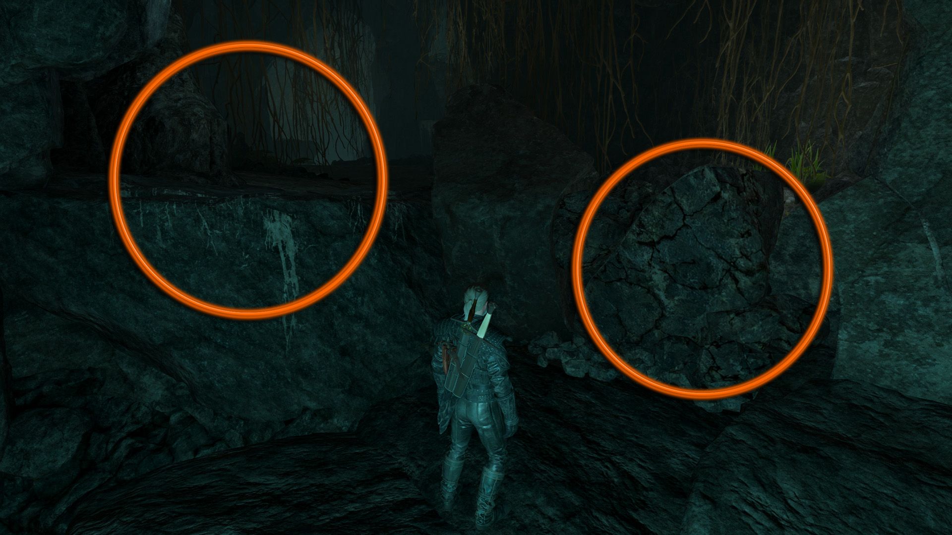 An edited screenshot of The Witcher 3, with two orange circles indicating two possible paths for Geralt to take inside a dark cave.
