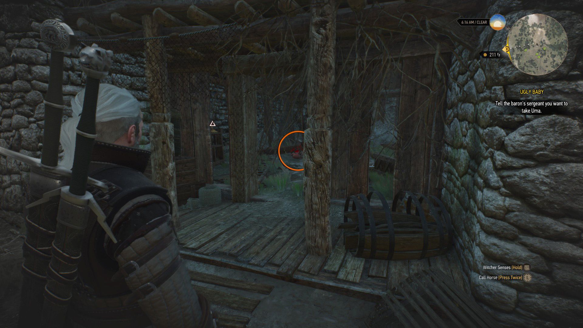 A screenshot of The Witcher 3, with an orange circle over a skeleton inside a house.
