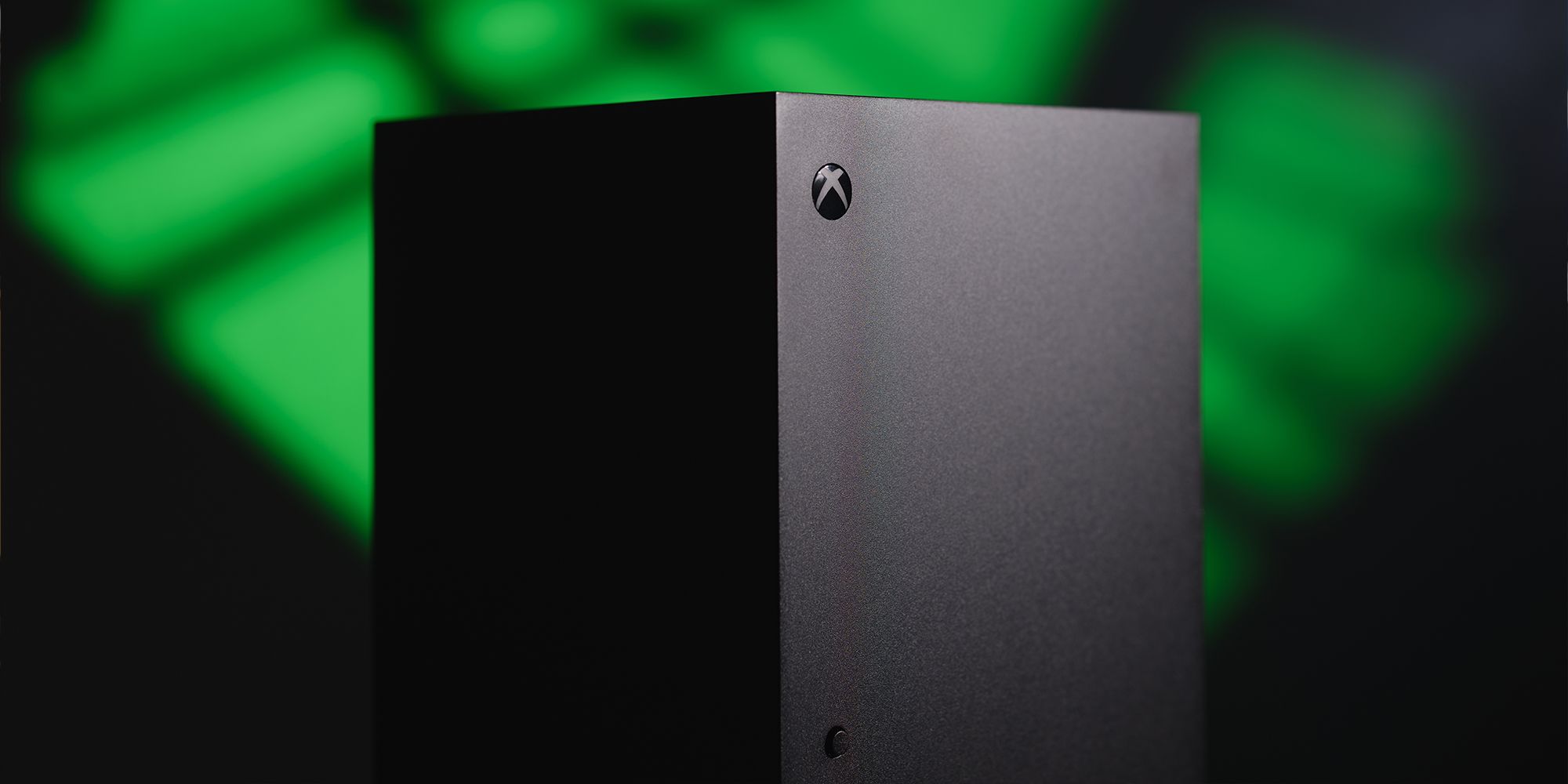 Xbox Series X over a blurred green and black background