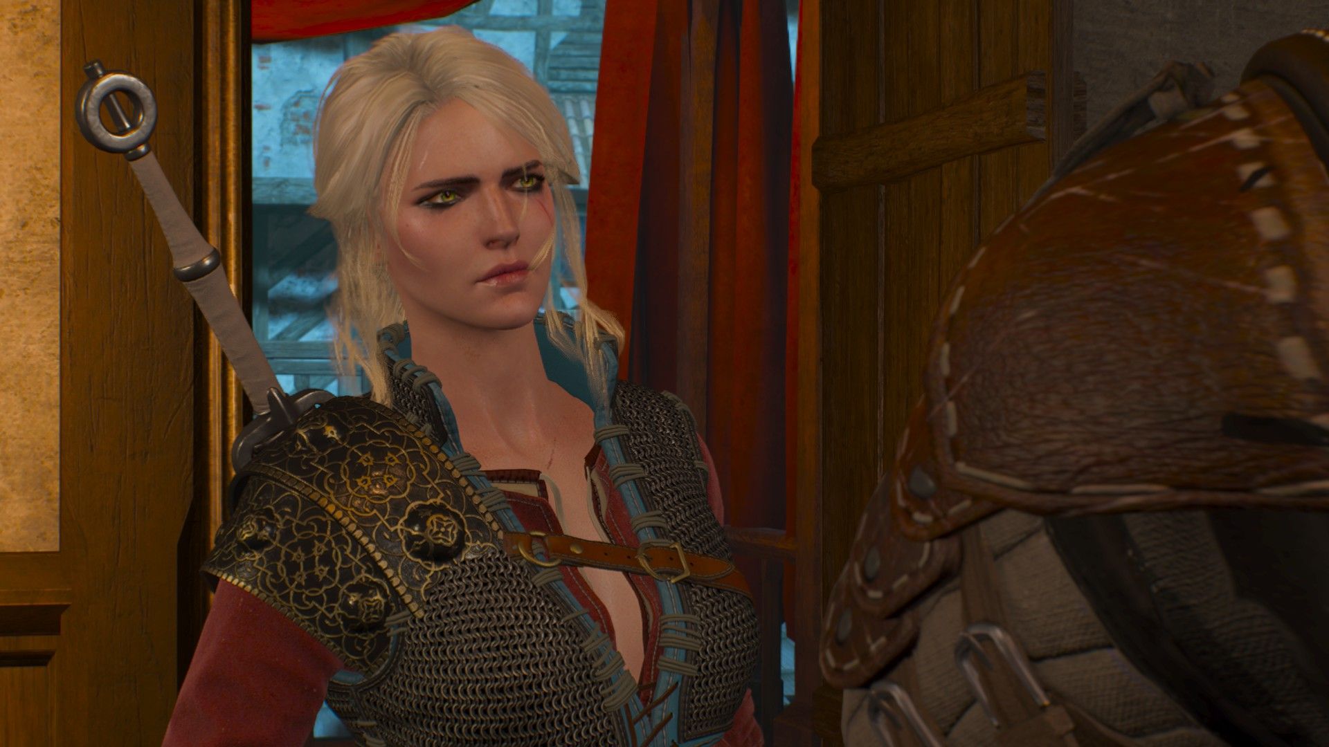 Ciri, wearing Skellige-style armor, talks to Geralt in Dandelion&rsquo;s Inn.