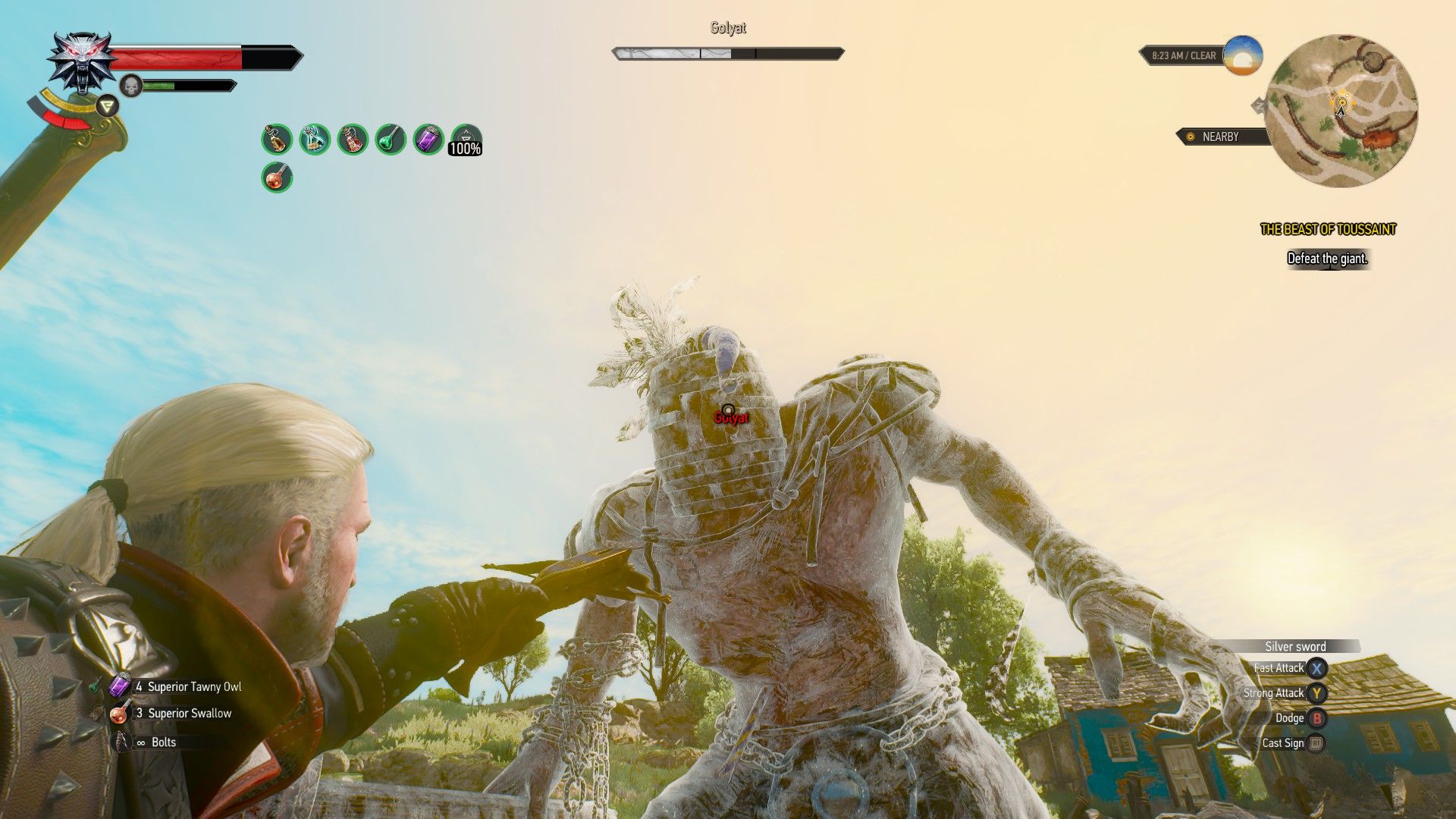 A screenshot of Geralt pointing a crossbow at a giant's head in The Witcher 3.
