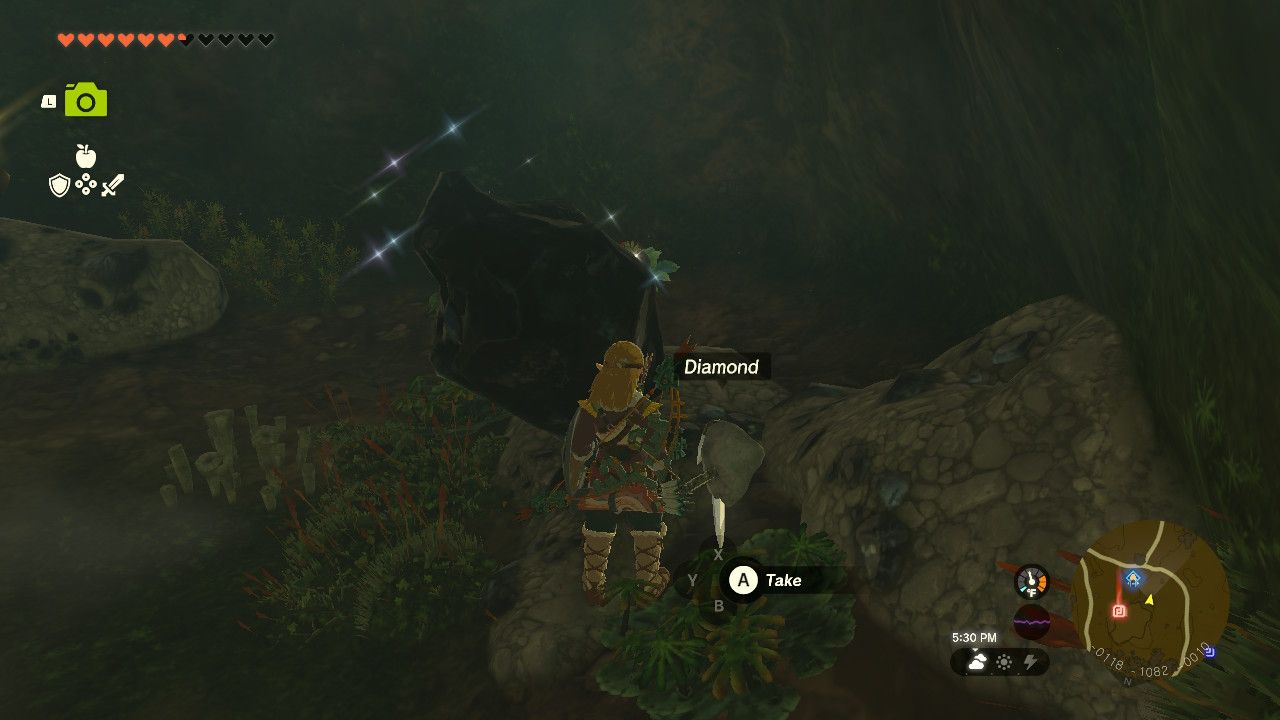 Link breaks open the ore deposit and finds the diamond