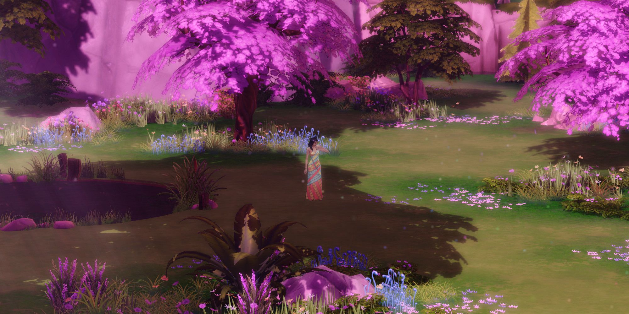 Sims from The Sims 4 stands in the middle of Sylvan Glade