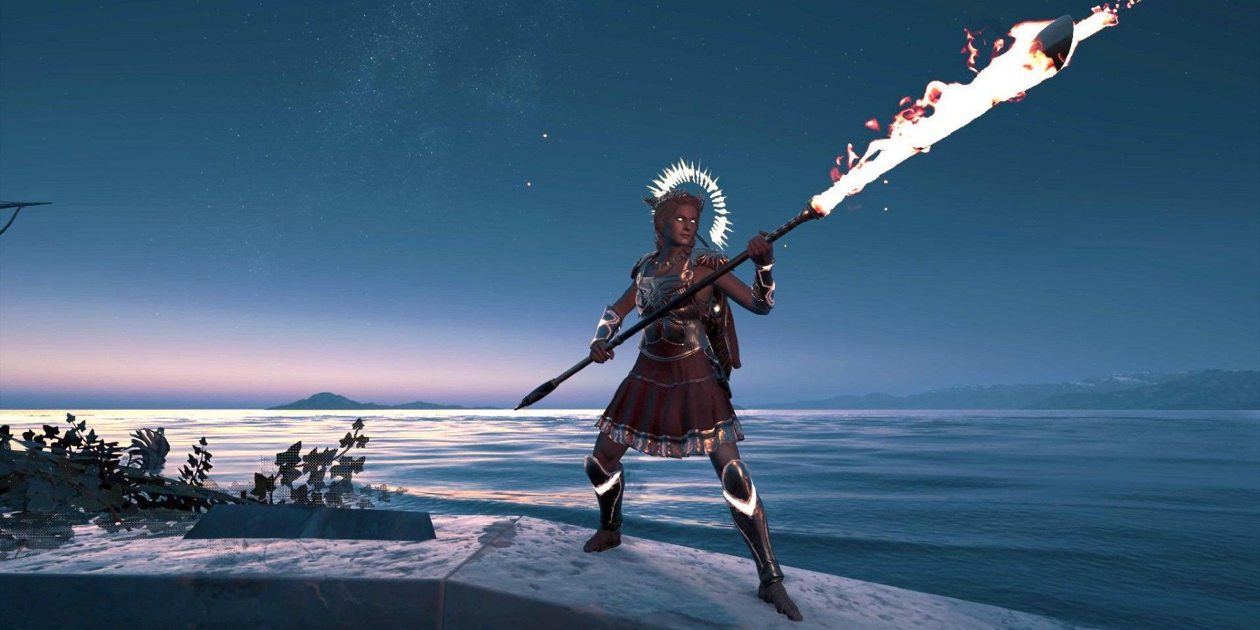 AC Odyssey Helios Radiant Armor set in twilight on shorline with flaming spear