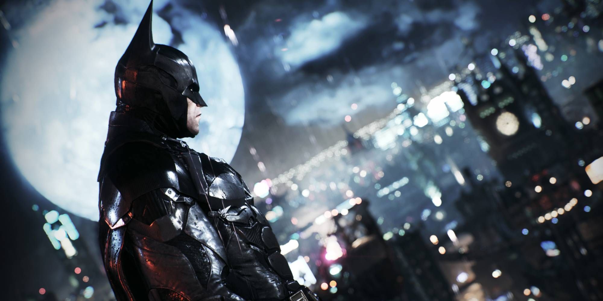 Batman looks over the city of Gotham on a rainy dark night in Batman Arkham Knight