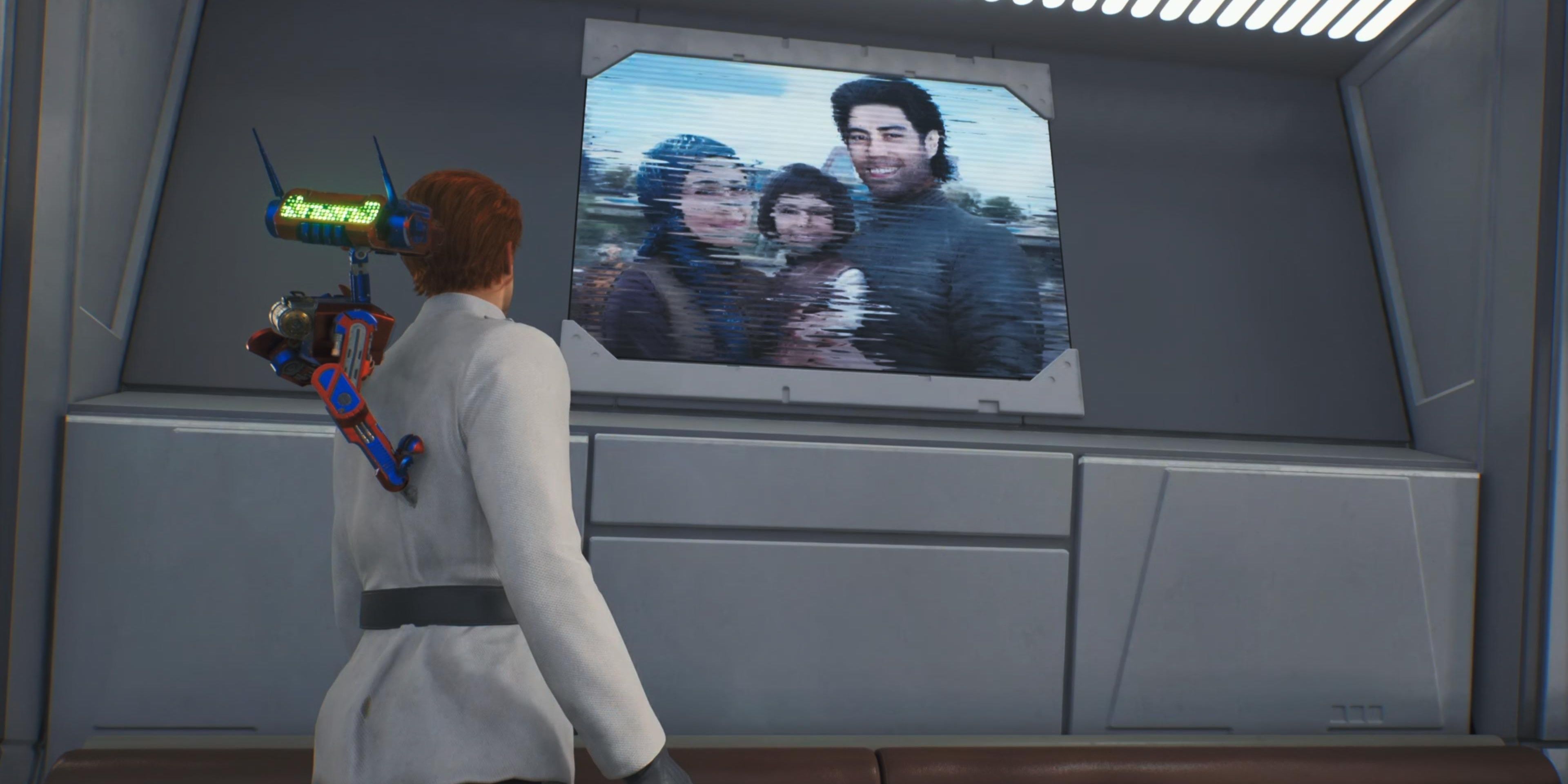 Cal looking at Bode's family photo In Star Wars Jedi: Survivor