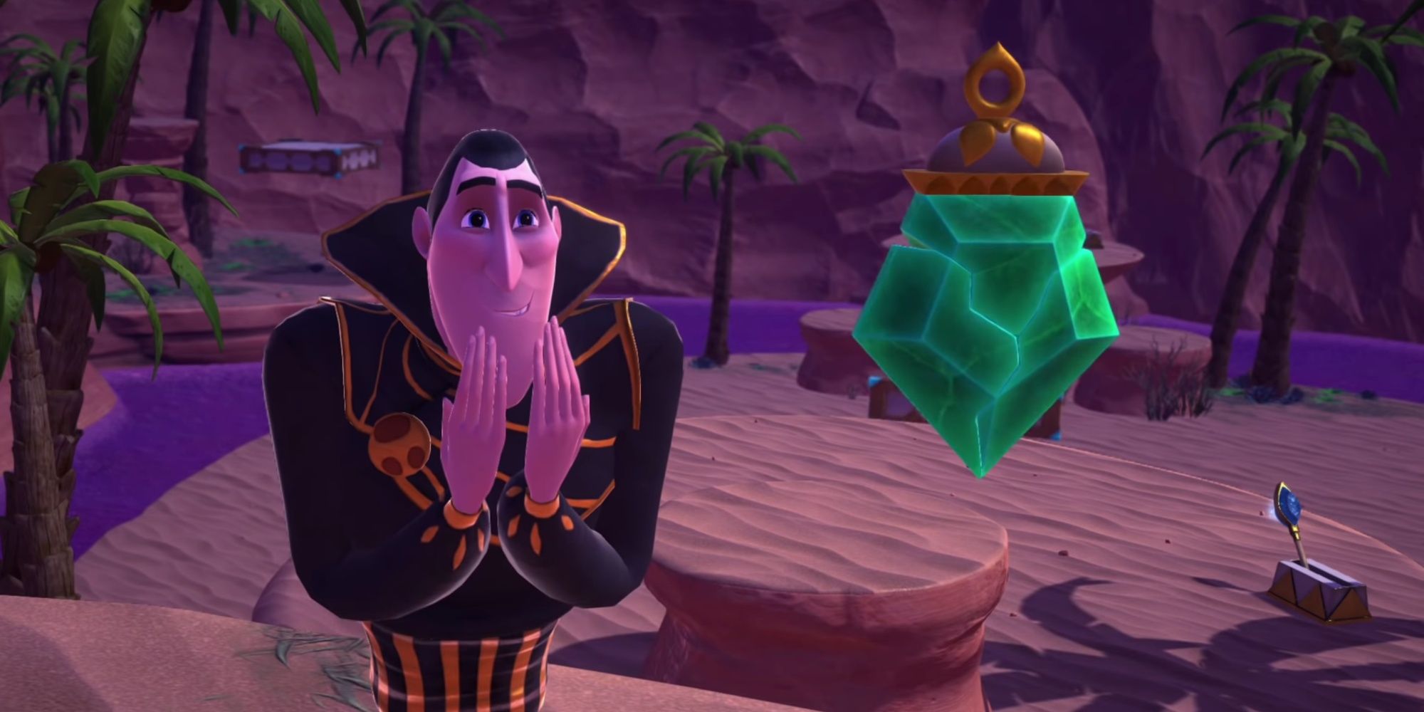 Dracula raises his hands over his chin and gazes at a green gemstone in the desert landscape.