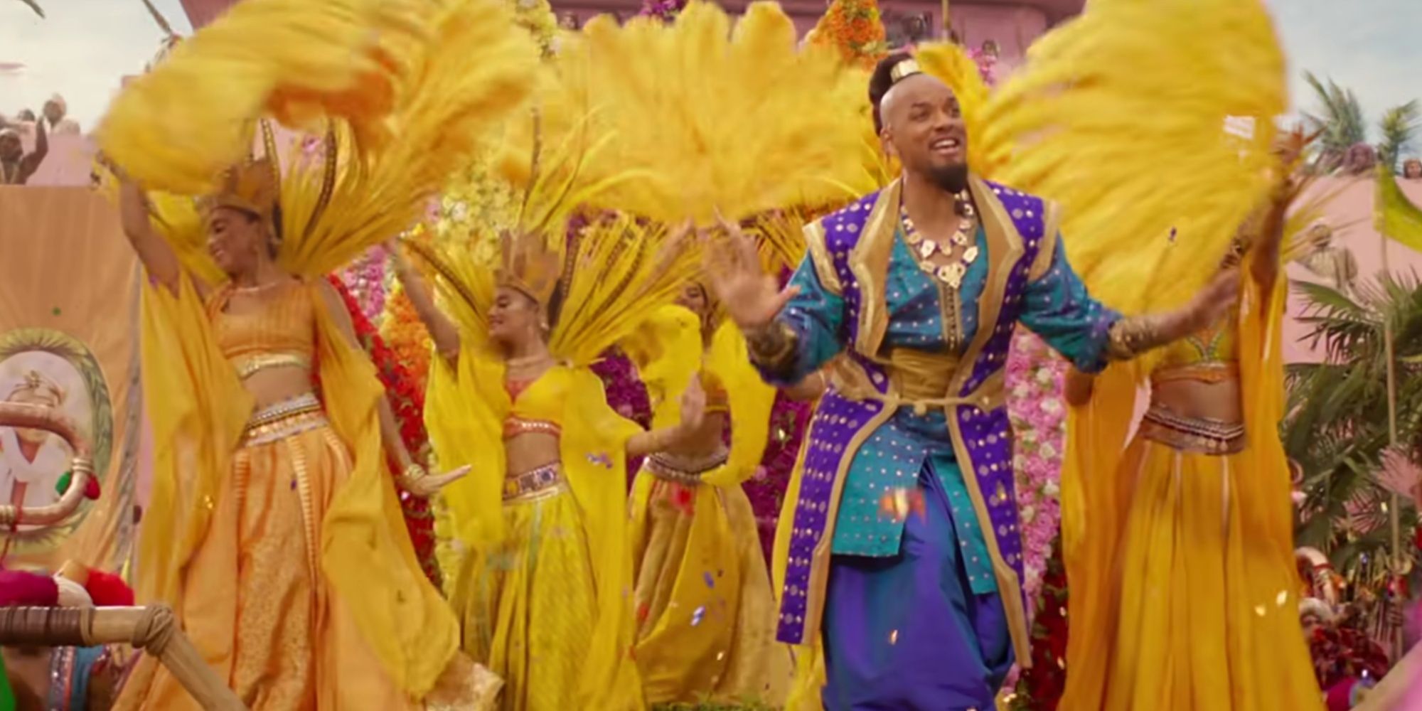 Will Smith dances and sings as Genie, introducing the new and improved Prince Ali with elephants and colorful backup dancers in the parade.