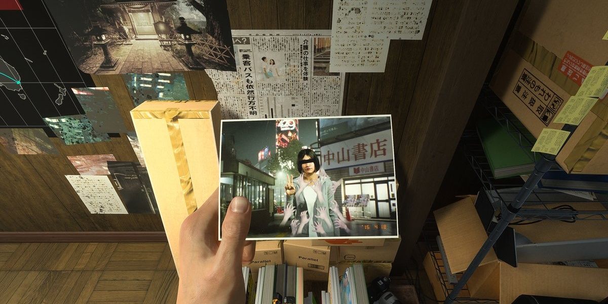 Akito holding a cursed photograph in KK's apartment