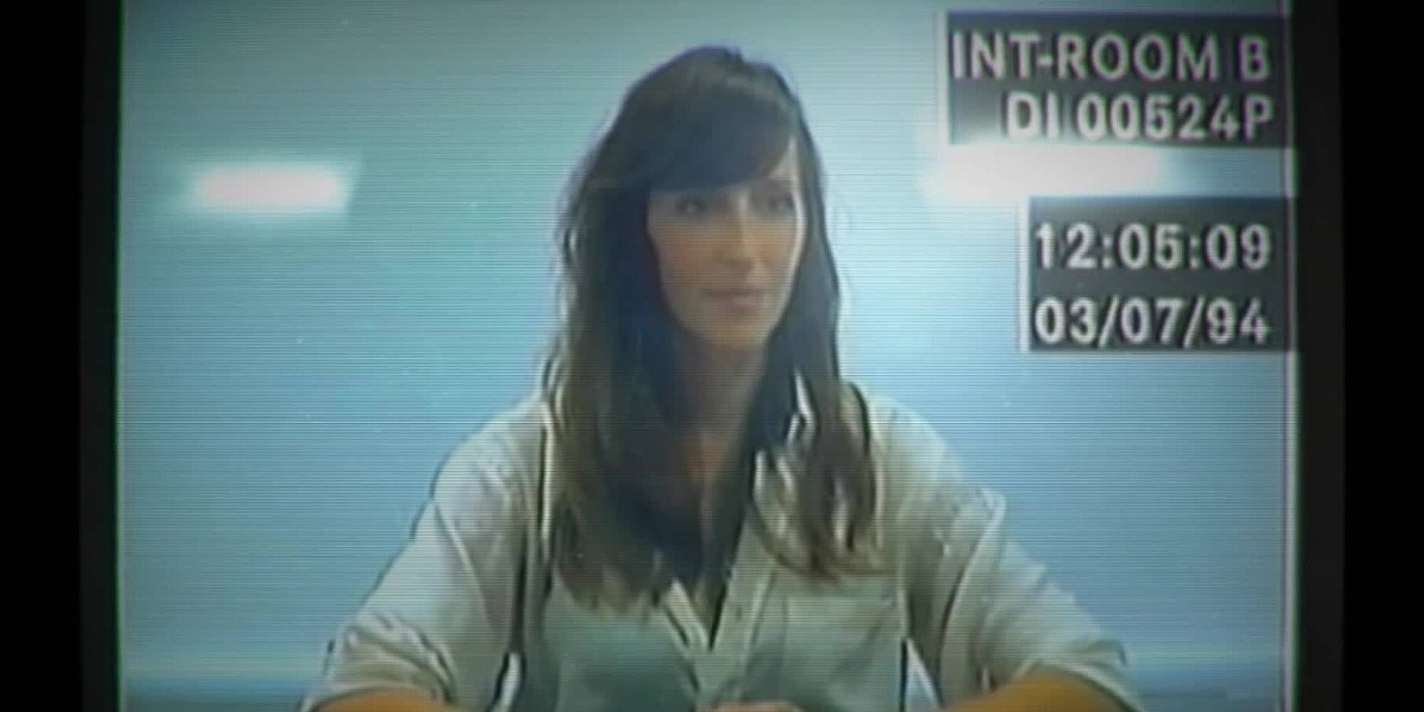 A VHS tape plays of Hannah/Eve from Her Story as she sits at a desk