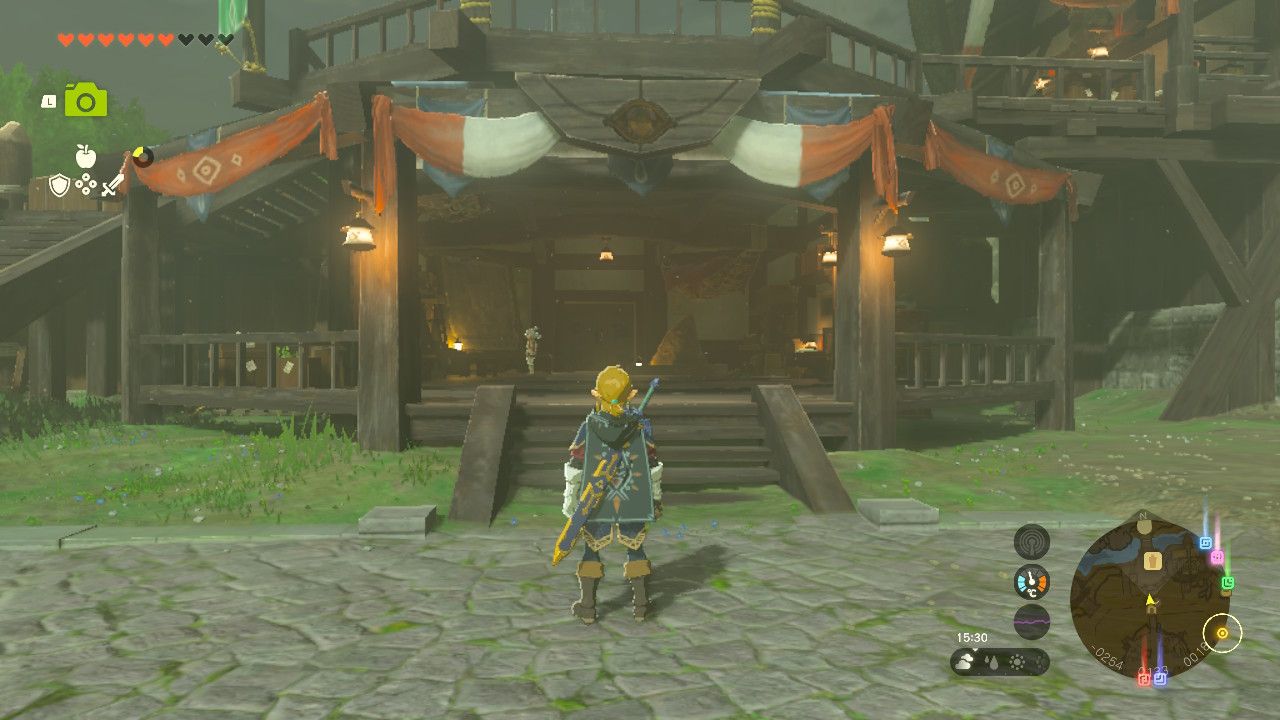 The Legend of Zelda: Tears of the Kingdom - Link stands outside of the research base in Lookout Landing