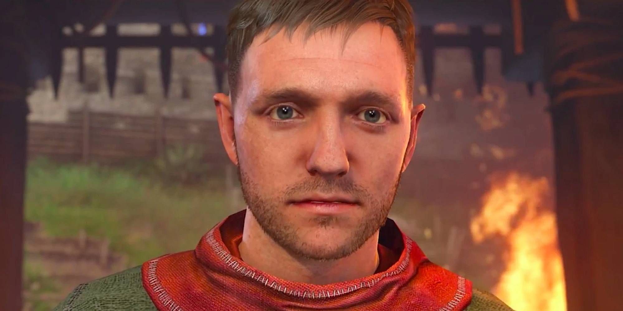 Henry stands at a castle gate as fire burns behind him in Kingdom Come Deliverance.