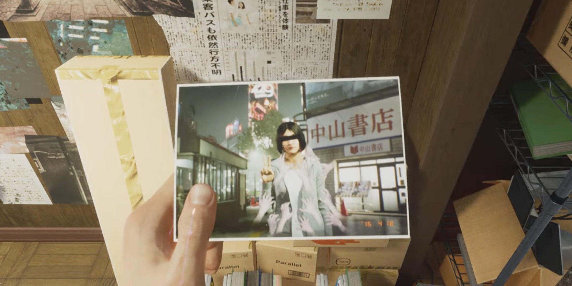 Akito holds a cursed picture in his hand
