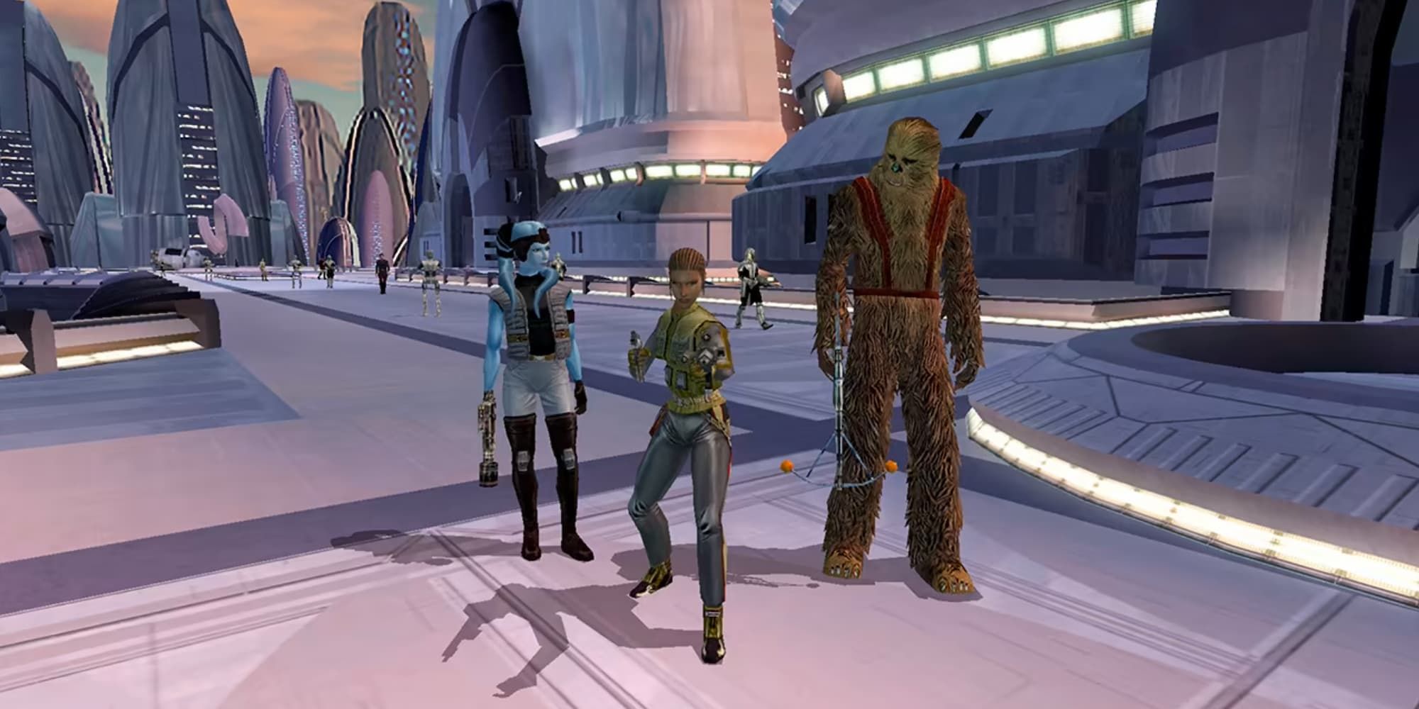The player character of Revan stands on Taris with Mission Vao and Zaalbar the wookie in KOTOR.