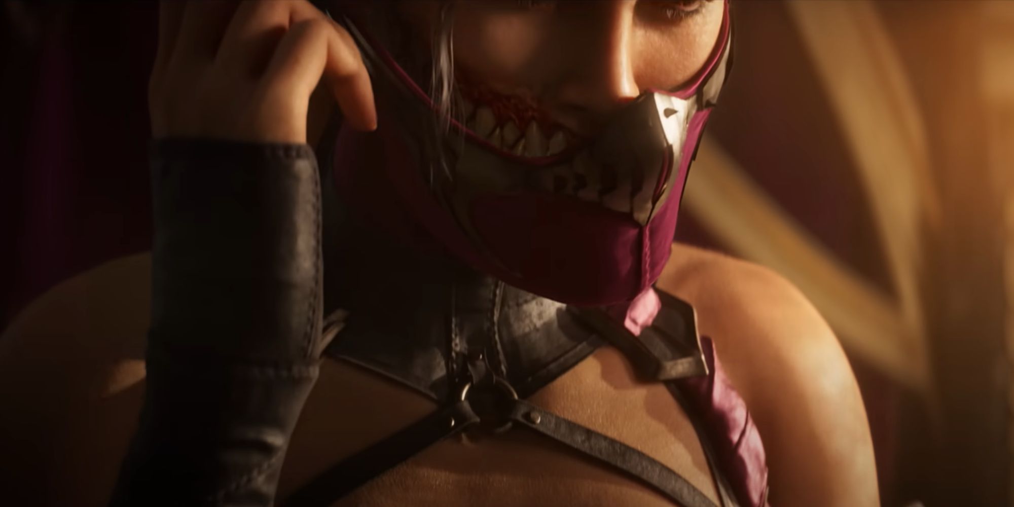 Mileena in the Mortal Kombat 1 trailer, putting on a pink mask to hide her huge sharpened teeth