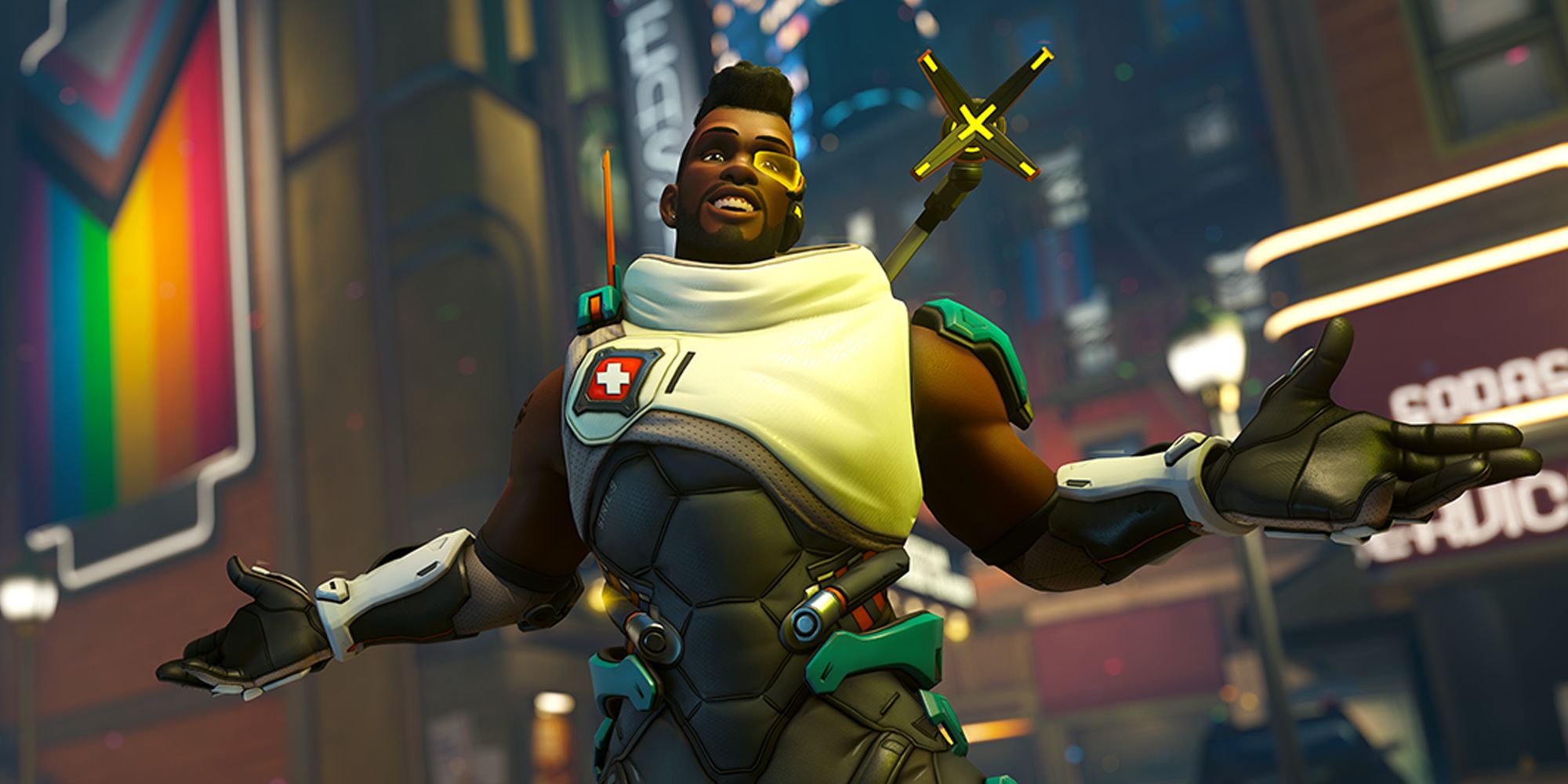 Overwatch 2 Baptiste with his arms out in front of a building with a vertical LGBTQ+ flag
