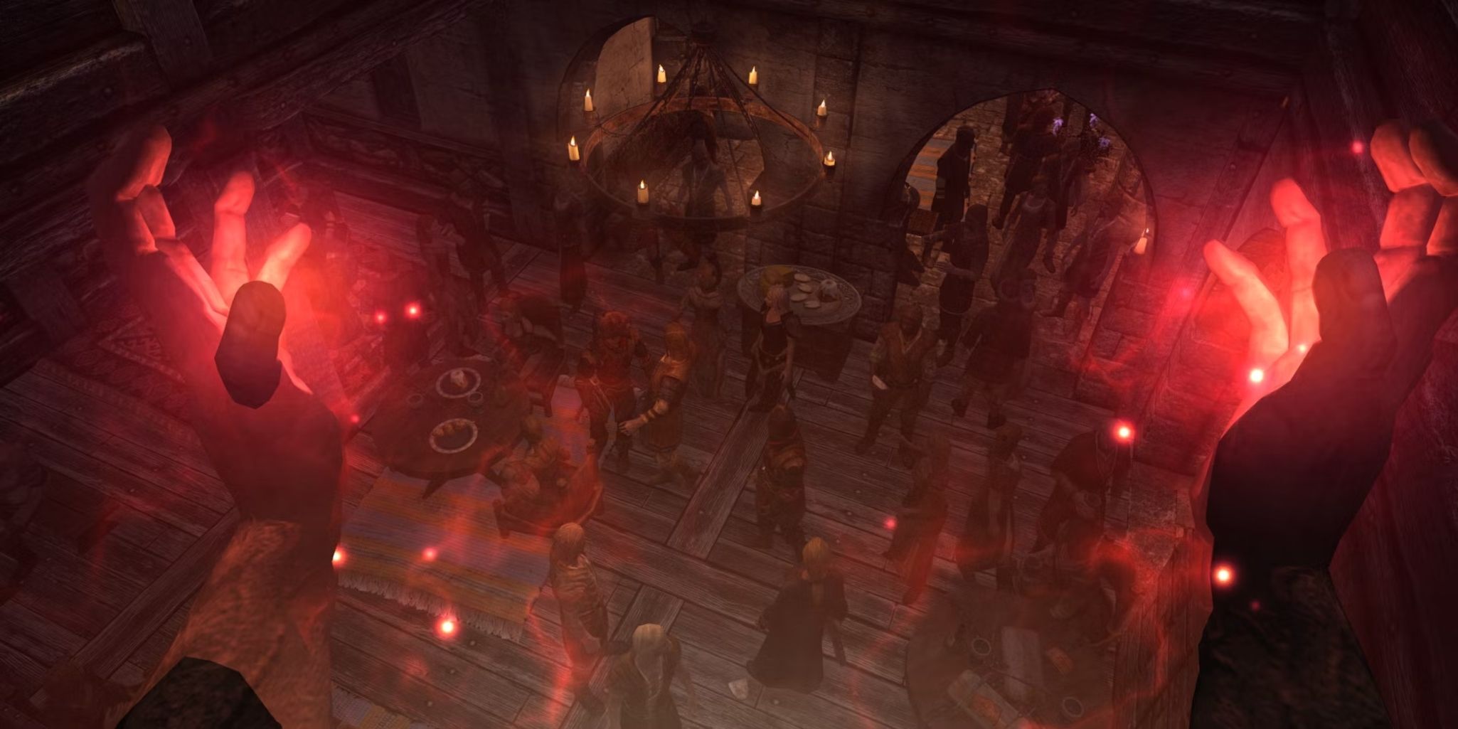 A player casting a red aura spell in front of a group of people inside a building.