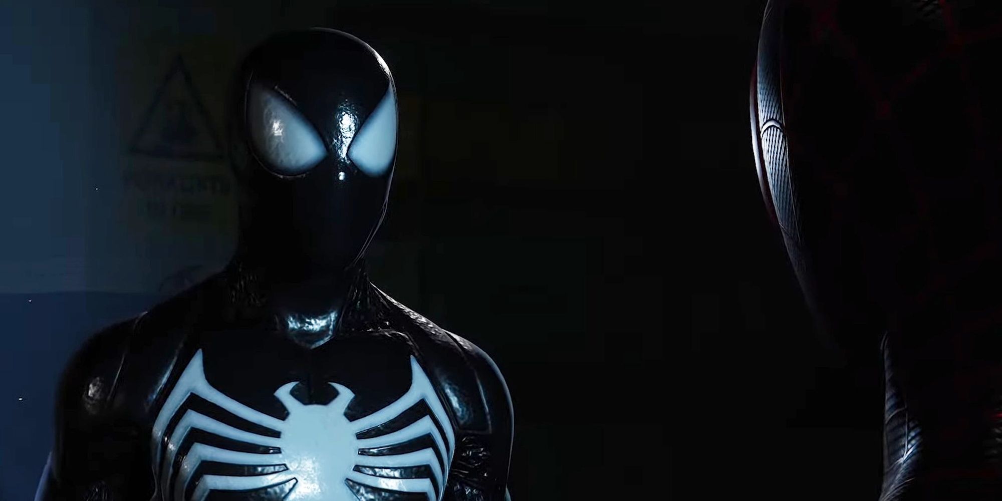 Spider-Man 2 screenshot showing Peter Parker in the symbiote suit talking to Miles Morales 