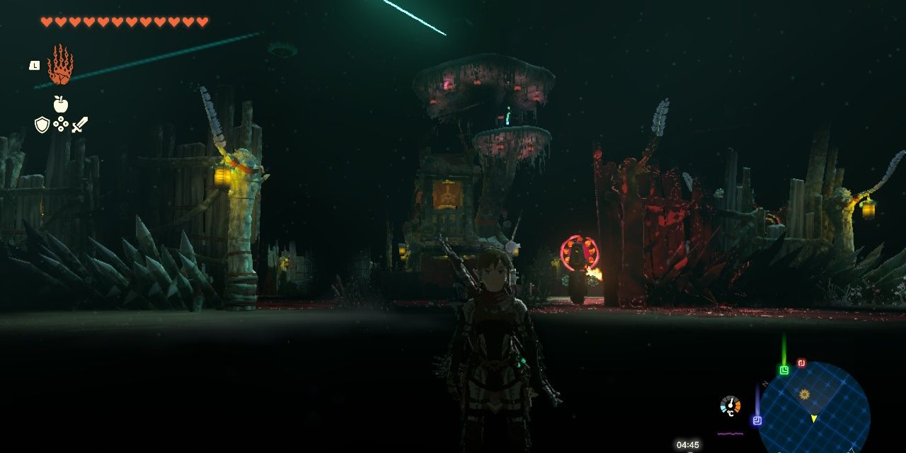 Tears of the Kingdom Link standing in front of Ega's lair surrounded by lights and beams.