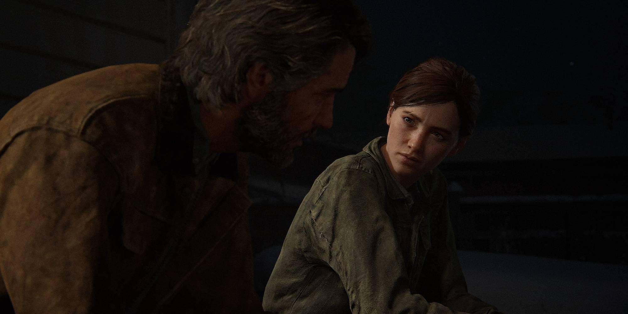 Ellie looks concered to an older Joe at night in The Last Of Us Part 2