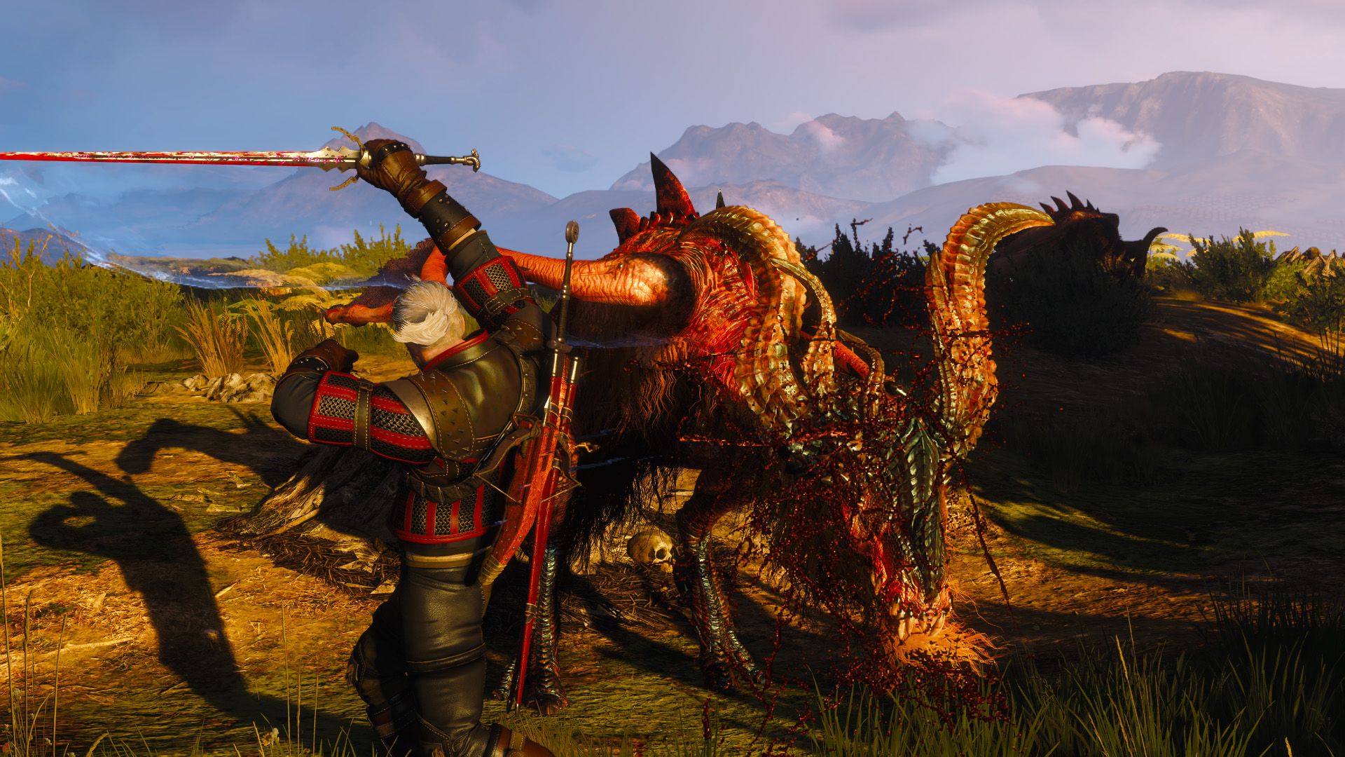 Geralt cuts a wyvern with a flourish as he fights the monster on a hill in the evening.