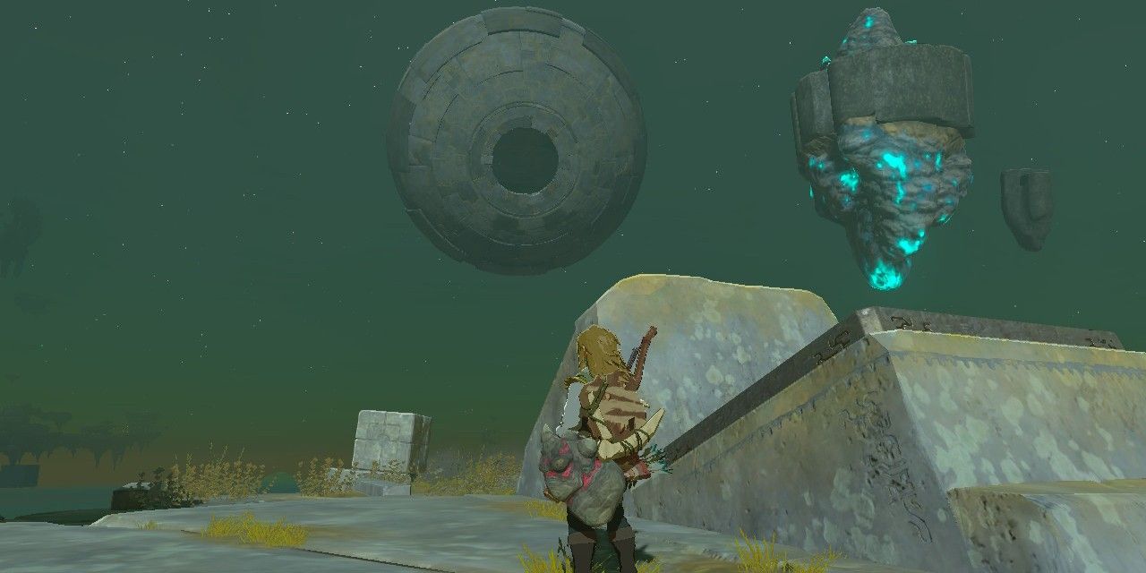 Capture D'Écran De Zelda Tears Of The Kingdom De Link Debout À Côté D'Un Lanceur Avec Un Grand Orbe En Arrière-Plan