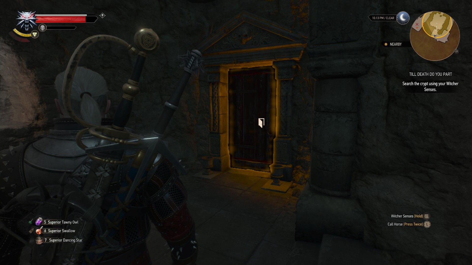 A screenshot of Geralt standing outside a room in a catacombs where a pair of ghosts argue inside.