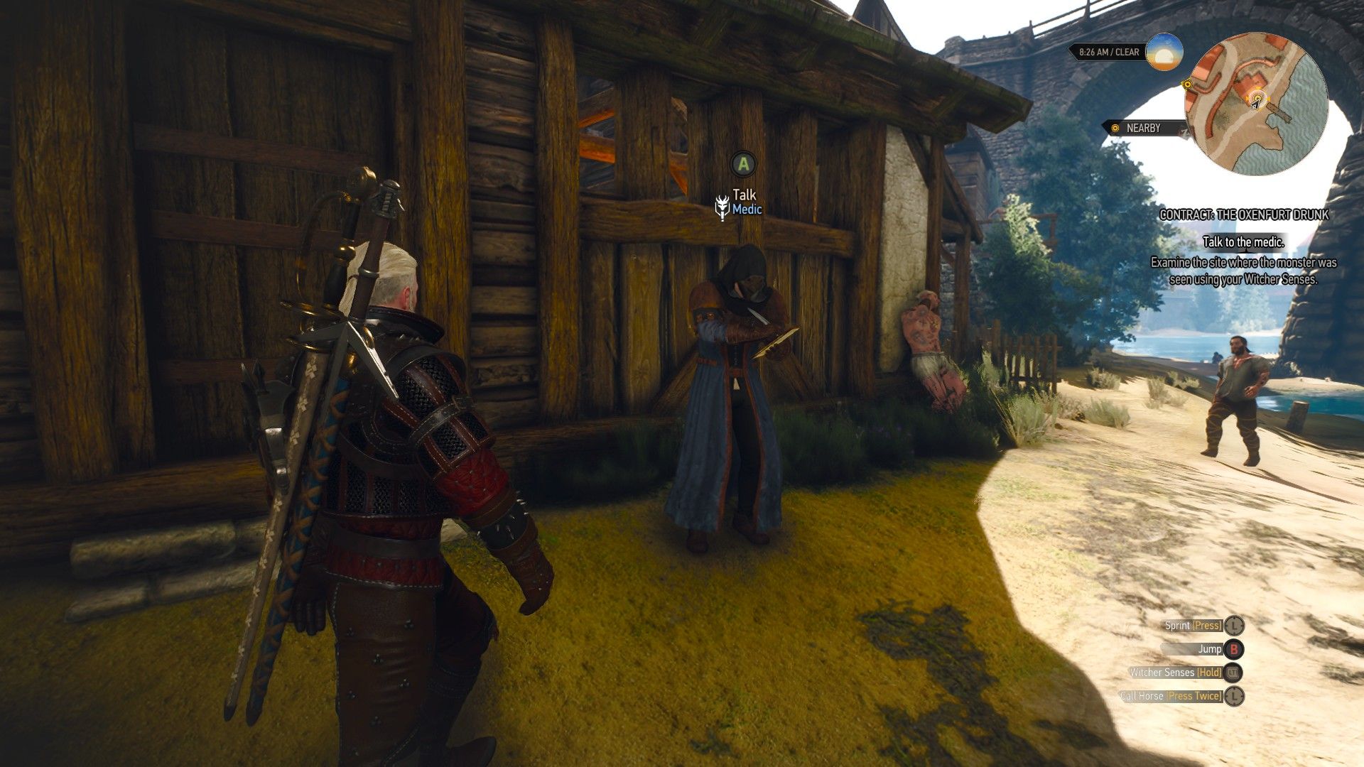 A screenshot of Geralt approaching a masked doctor by the river bank at Oxenfurt.