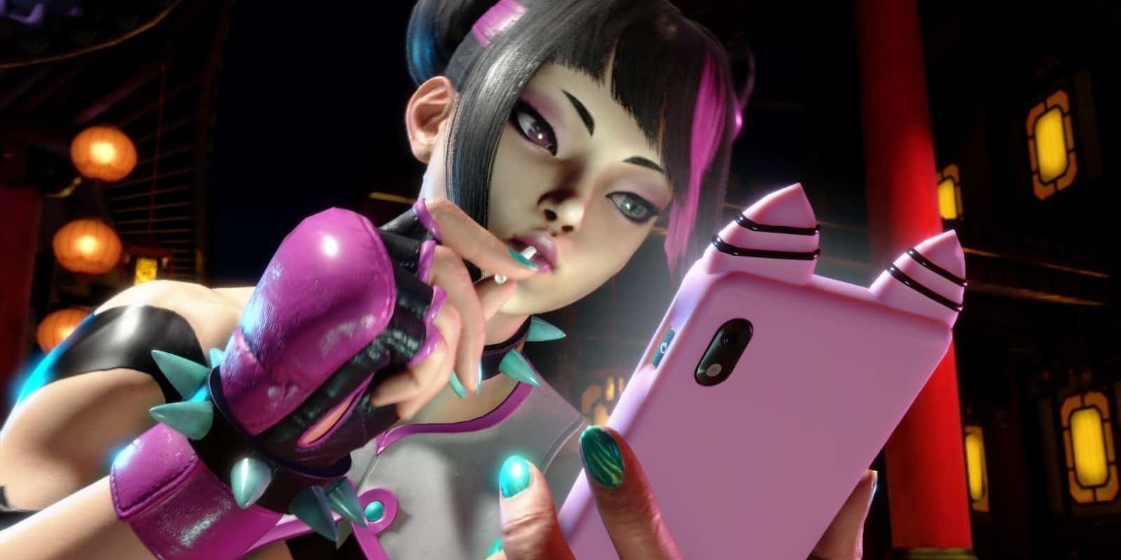Juri looking at her phone with a lolipop in her mouth