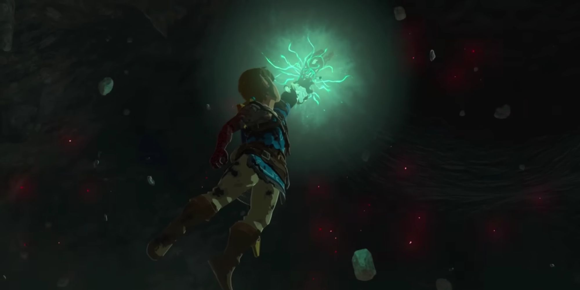 Link being pulled up by Rauru's hand in Tears of the Kingdom.